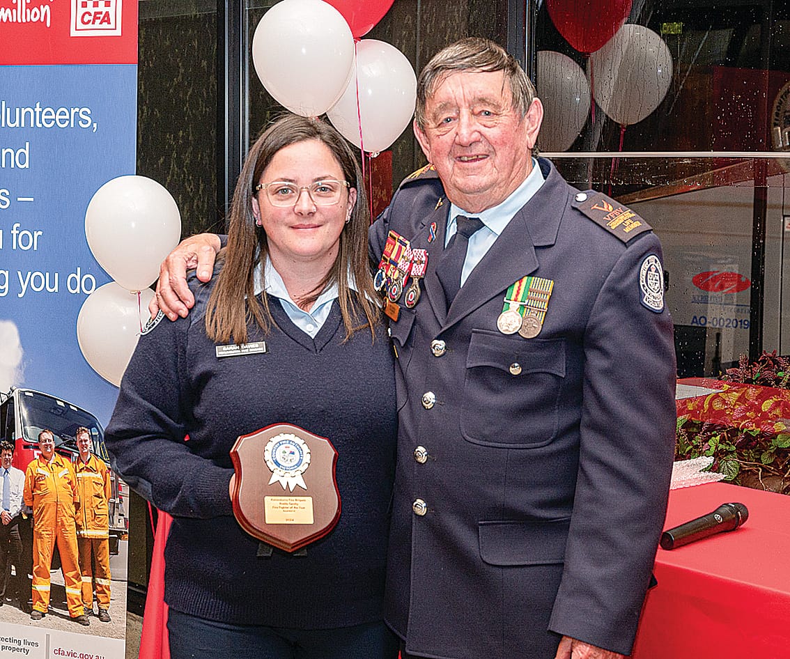 CFA Community Safety Coordinator and Communications Officer Sarah Davies with fifty-year service award recipient Bill Rodda.