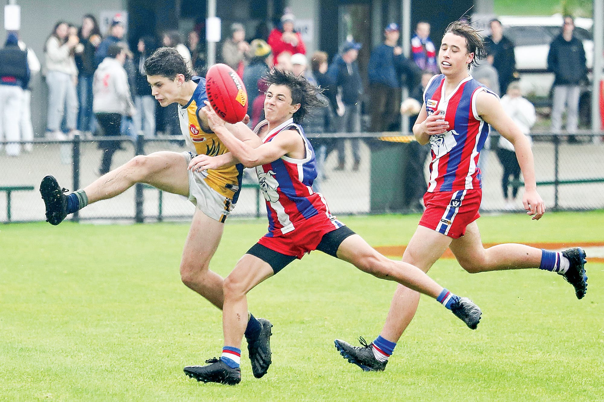 Under 16s Phillip Island’s Benji Chihotski gets the tackle. 