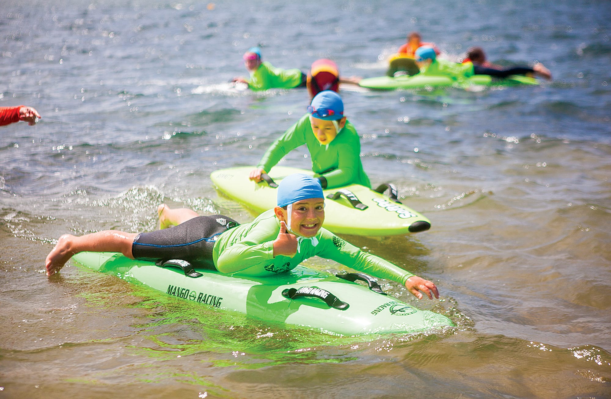 Under 10 Nippers mastering board paddling at Cleeland Bight Beach. 