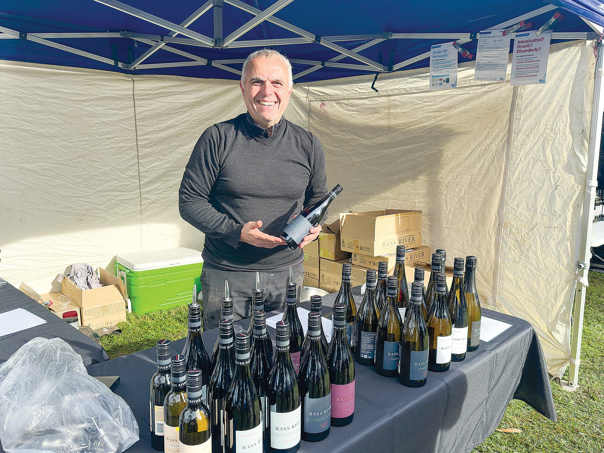 Frank Butera shows off his local bottles of wine from Bass River Winery in Glen Forbes. 
