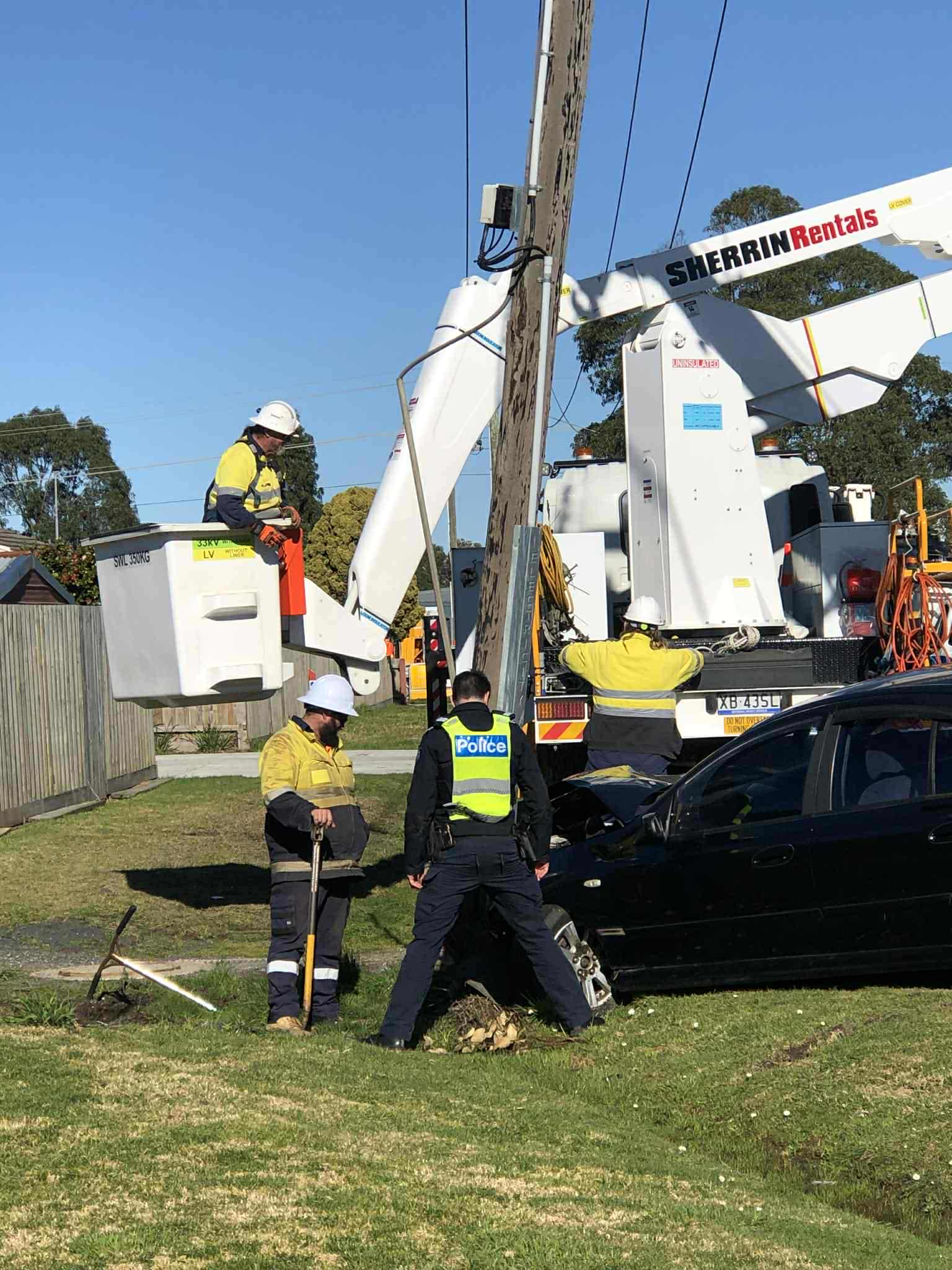 Car snaps power pole in collision
