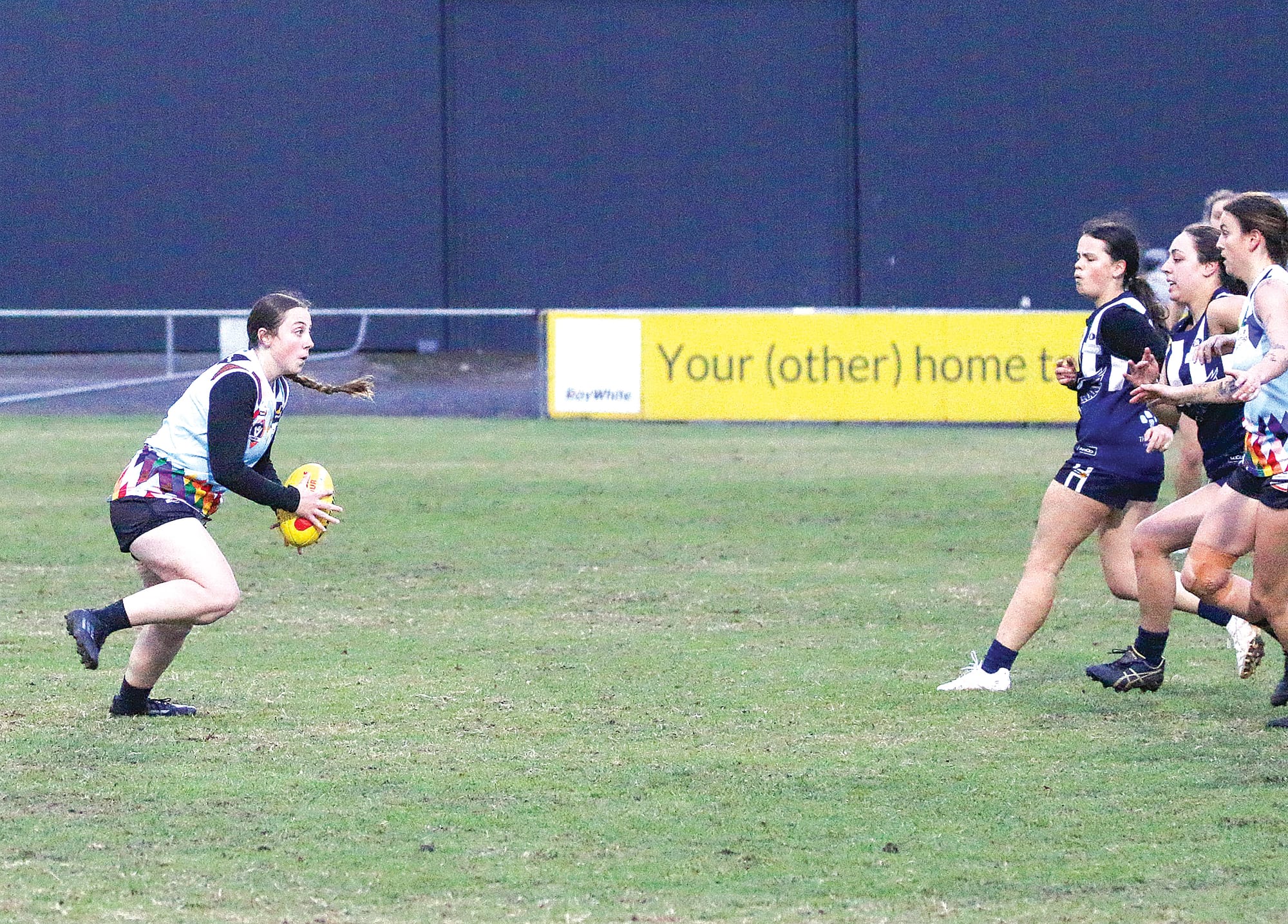 28 boots it towards Breakers goals.