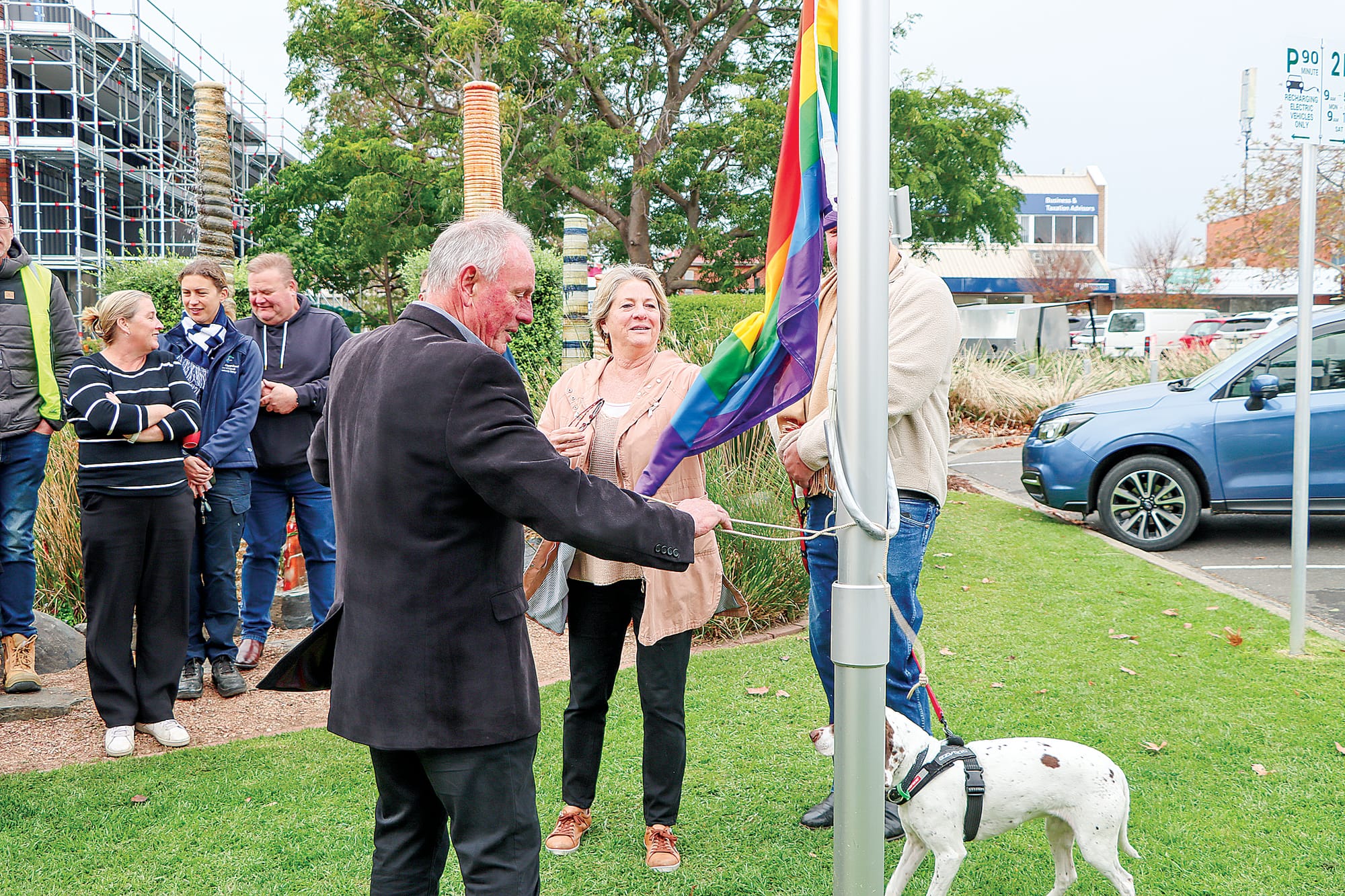 Cr John Schelling prepares for the raising of the rainbow flag in Leongatha.
