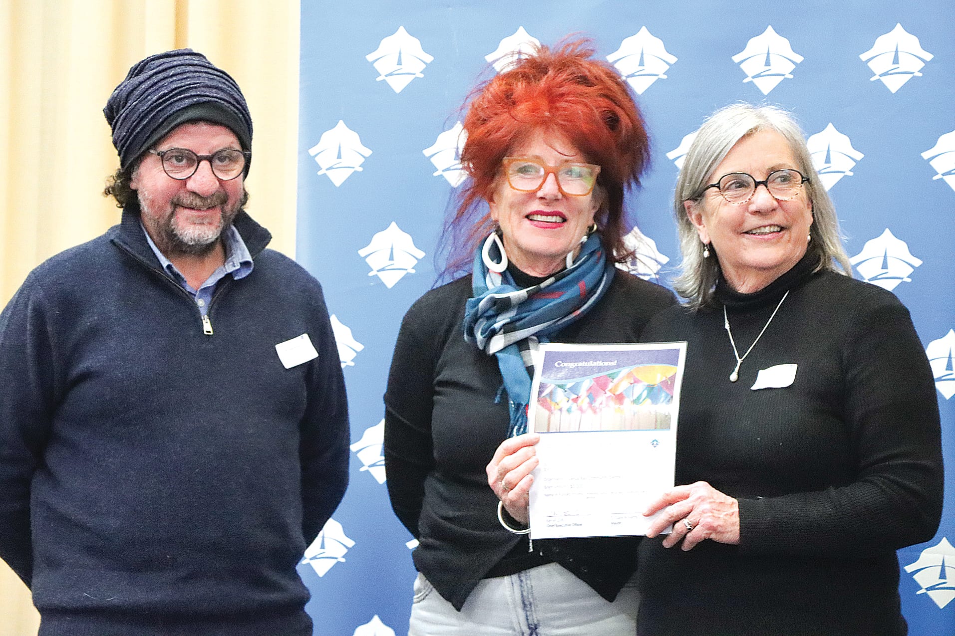 Bill Karambatsos and Alyson Skinner of Venus Bay Community Centre receive $3000 towards promoting ‘Sunny’, the electric minibus, with Cr Mohya Davies. A13_3124