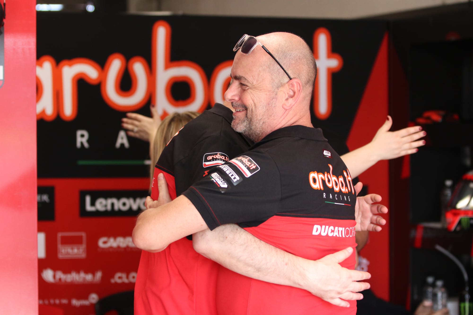 It was hugs all around as Aruba.it Racing celebrated Bulega's win.