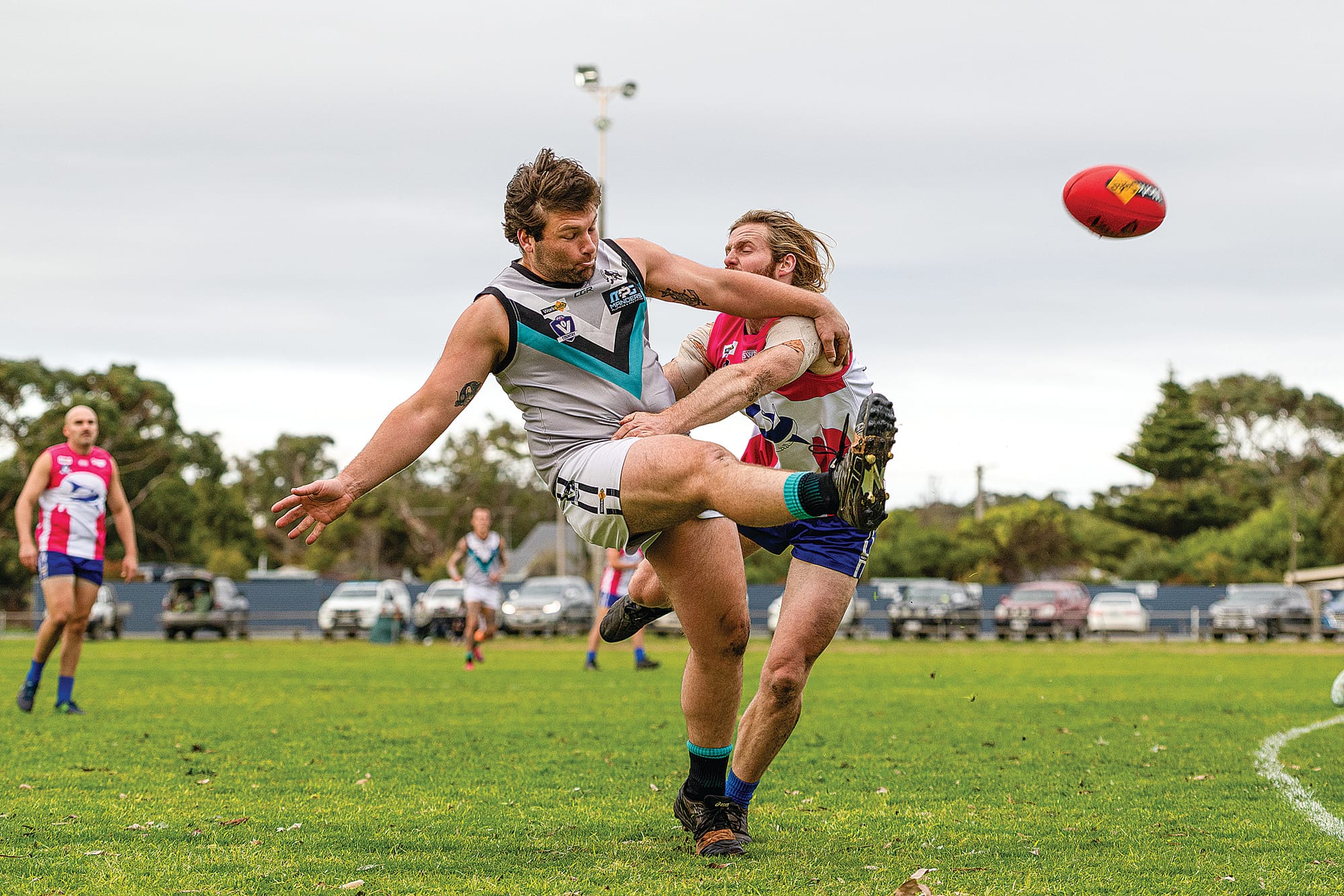 Jonathan Pintus gets the ball away just in time of the tackle for Toora. Photo: Bec Casey Sports Photography. 