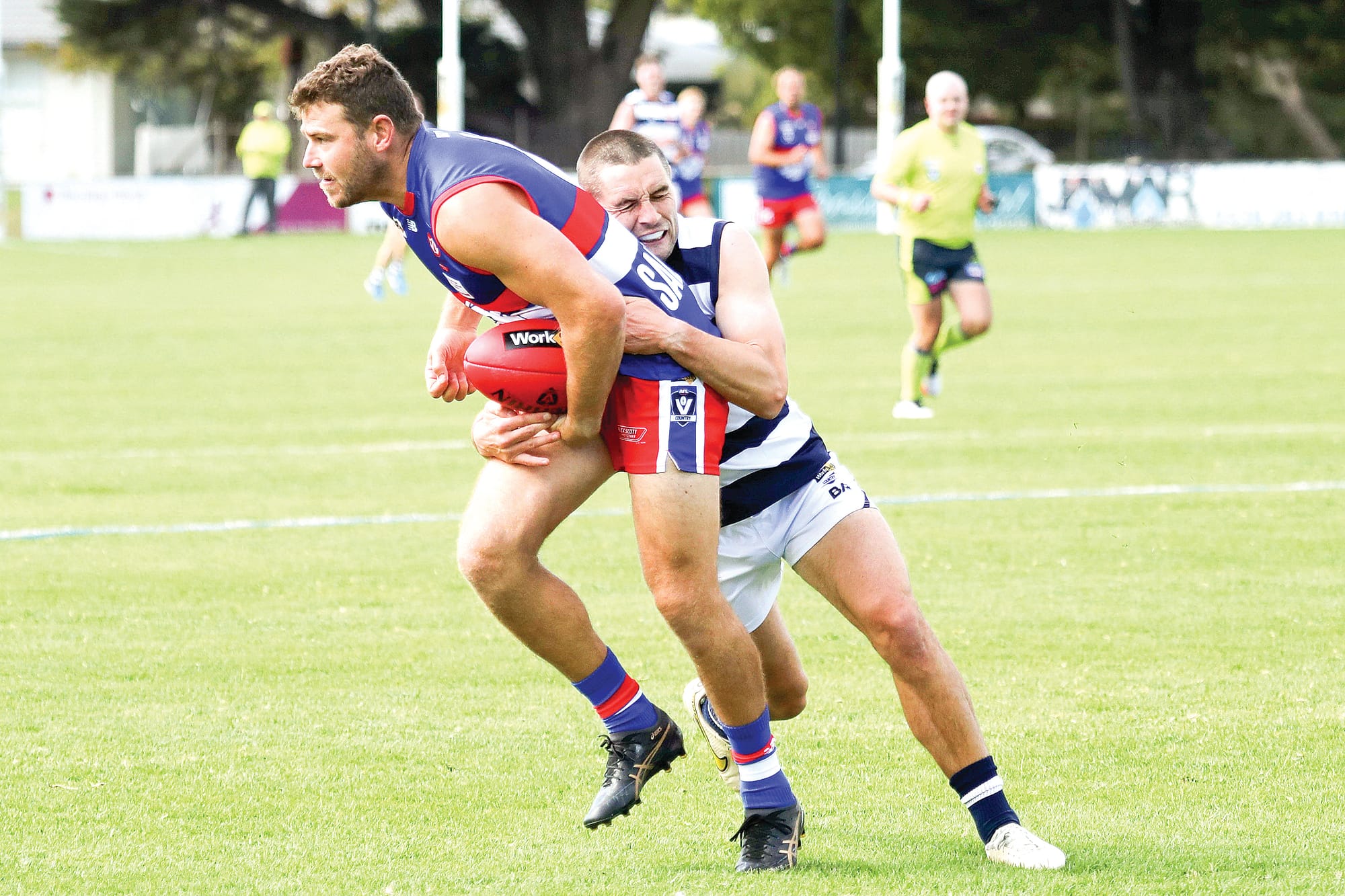 Mark Griffin is tackled from behind. Photos: Carol Ratcliff.