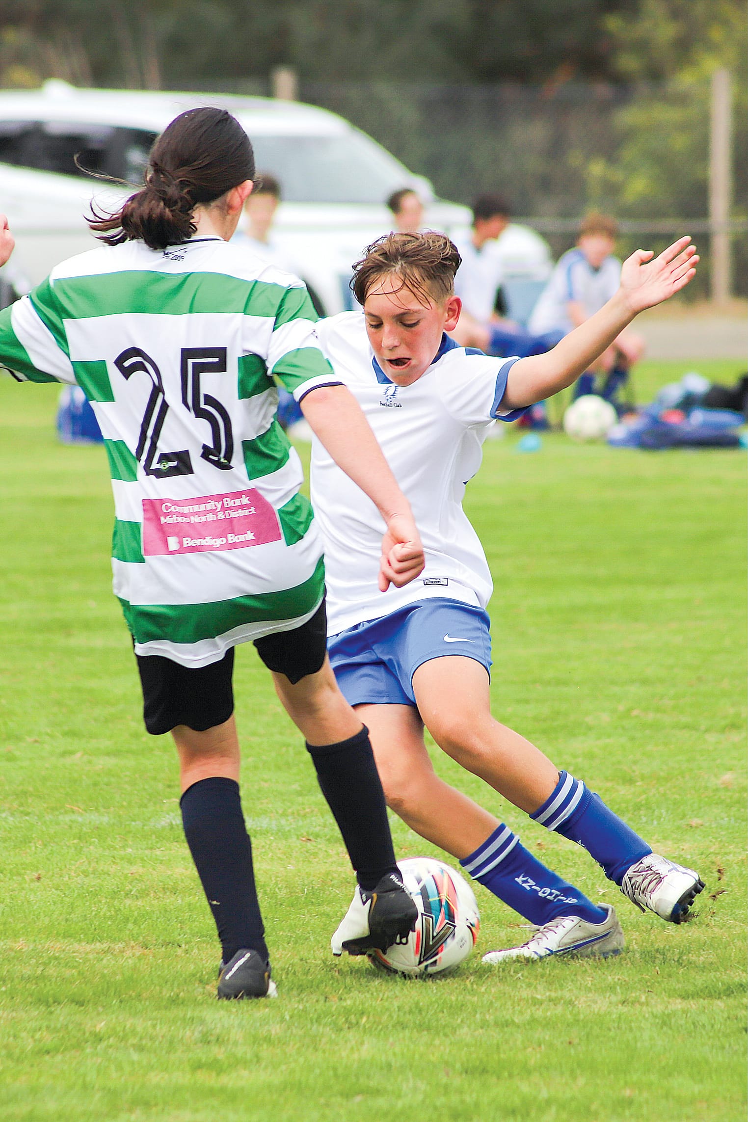 LKFC’s Heath Clifford pressures his opponent for the ball.
