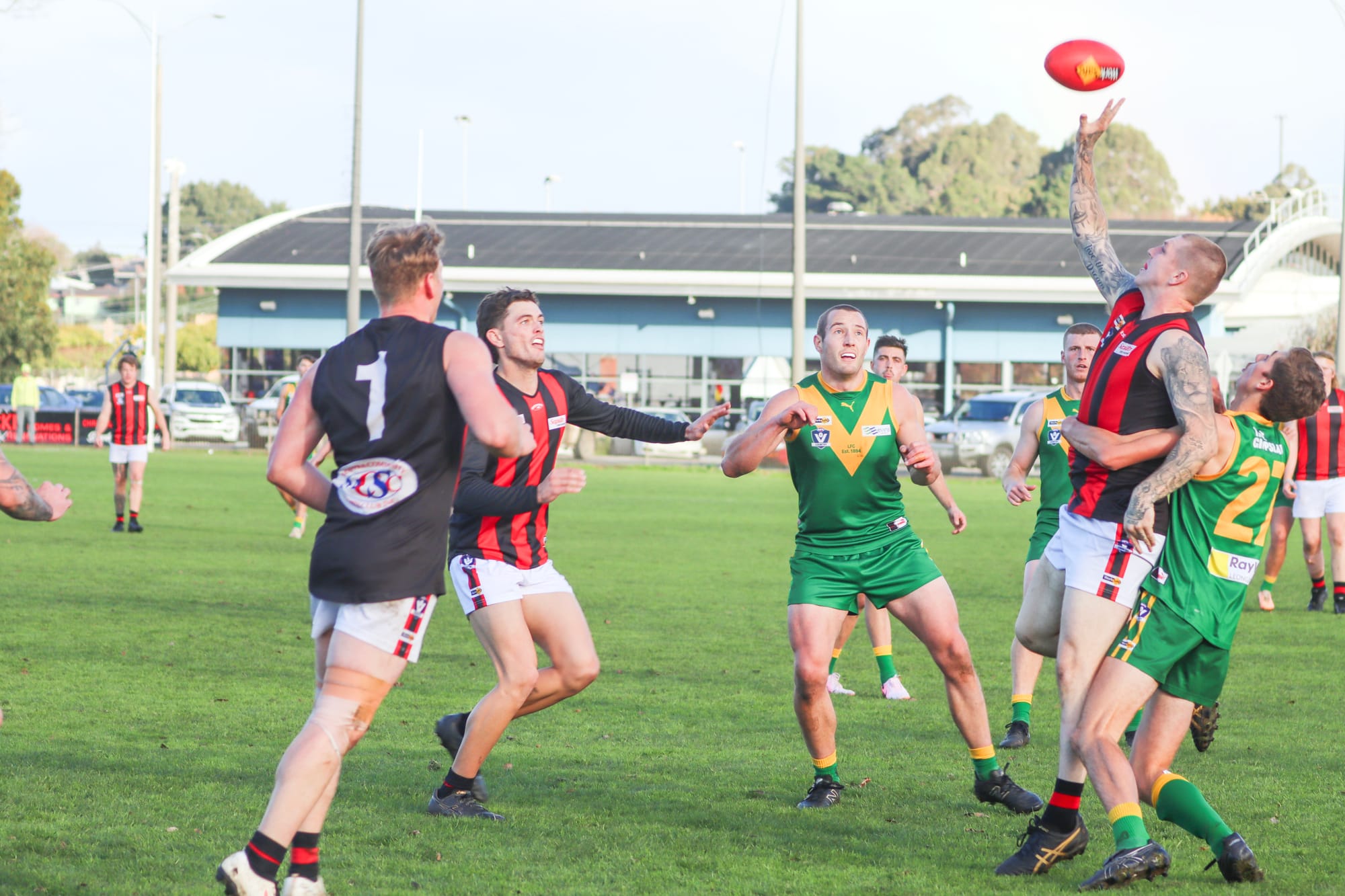 Star of the day and Leongatha skipper Tom Marriott has his eyes firmly on the footy as his teammate Noah Fixter tangles with his Maffra opponent. A18_2524