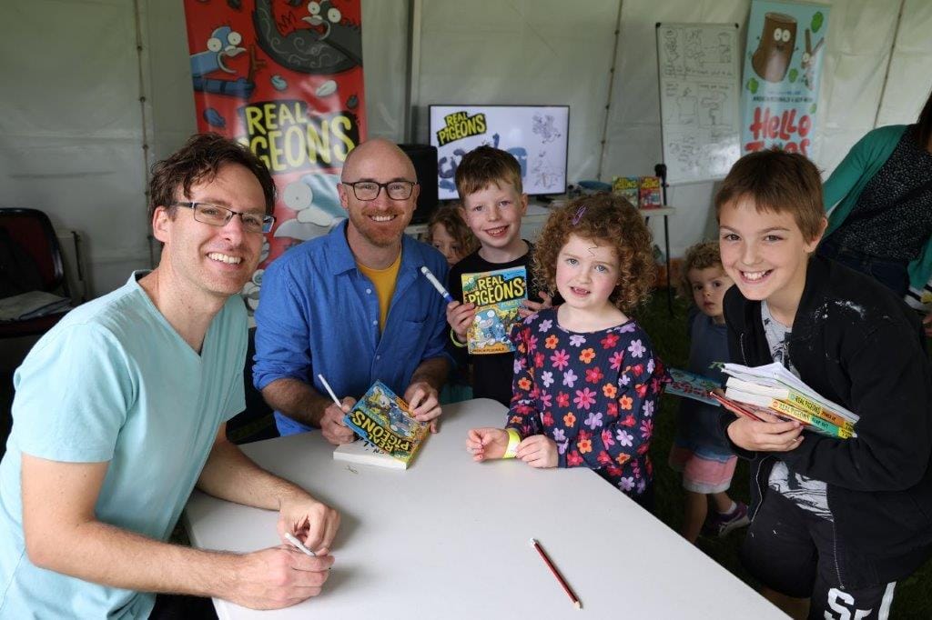 Children’s author and Illustrator Andrew McDonald and Ben Wood sign autographs for young admirers including Francis, Greta and Leo.