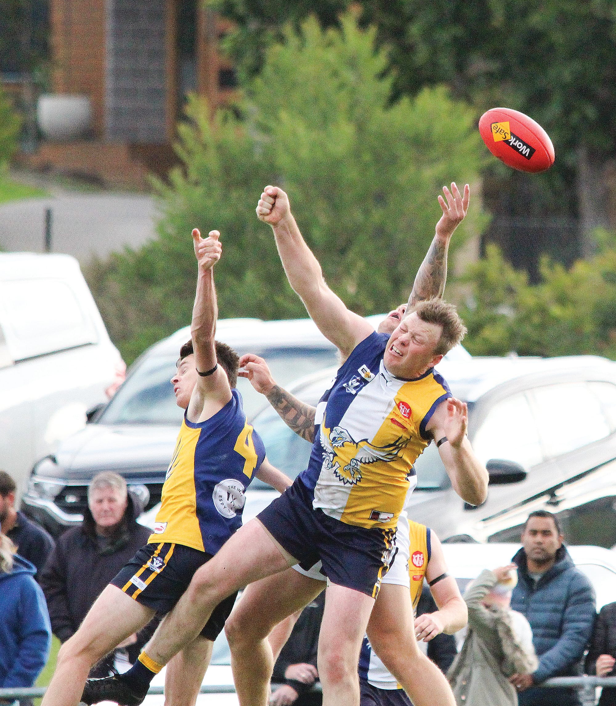 Fists and arms fly as players contest the ball in the air and Cooper Pursell (10) looks to grab the crumb. B04_1523