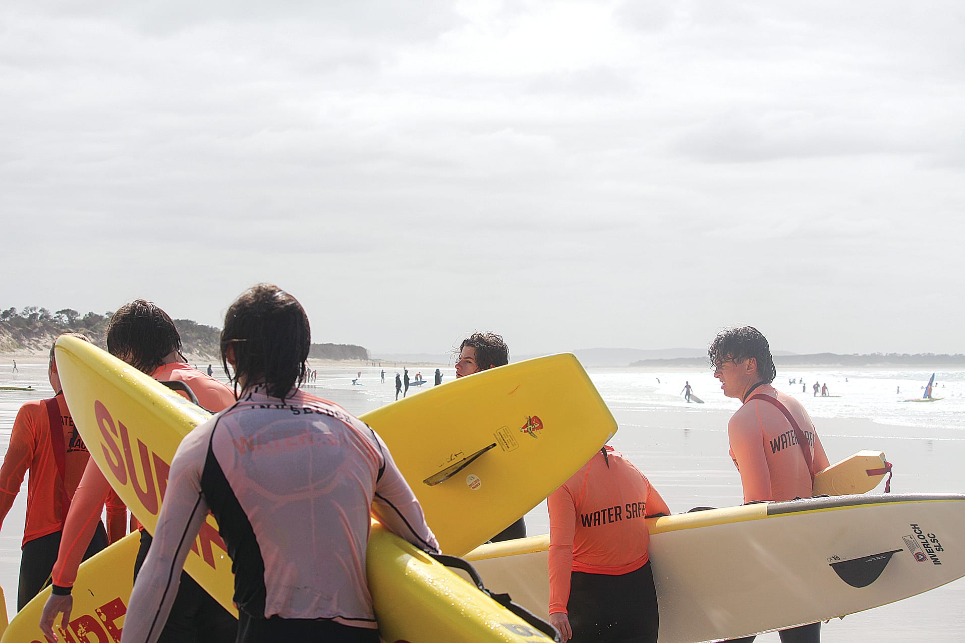 Some of Inverloch SLSC’s 50 water safety helpers head back after helping out the under 13s nippers’ group in the surf. 