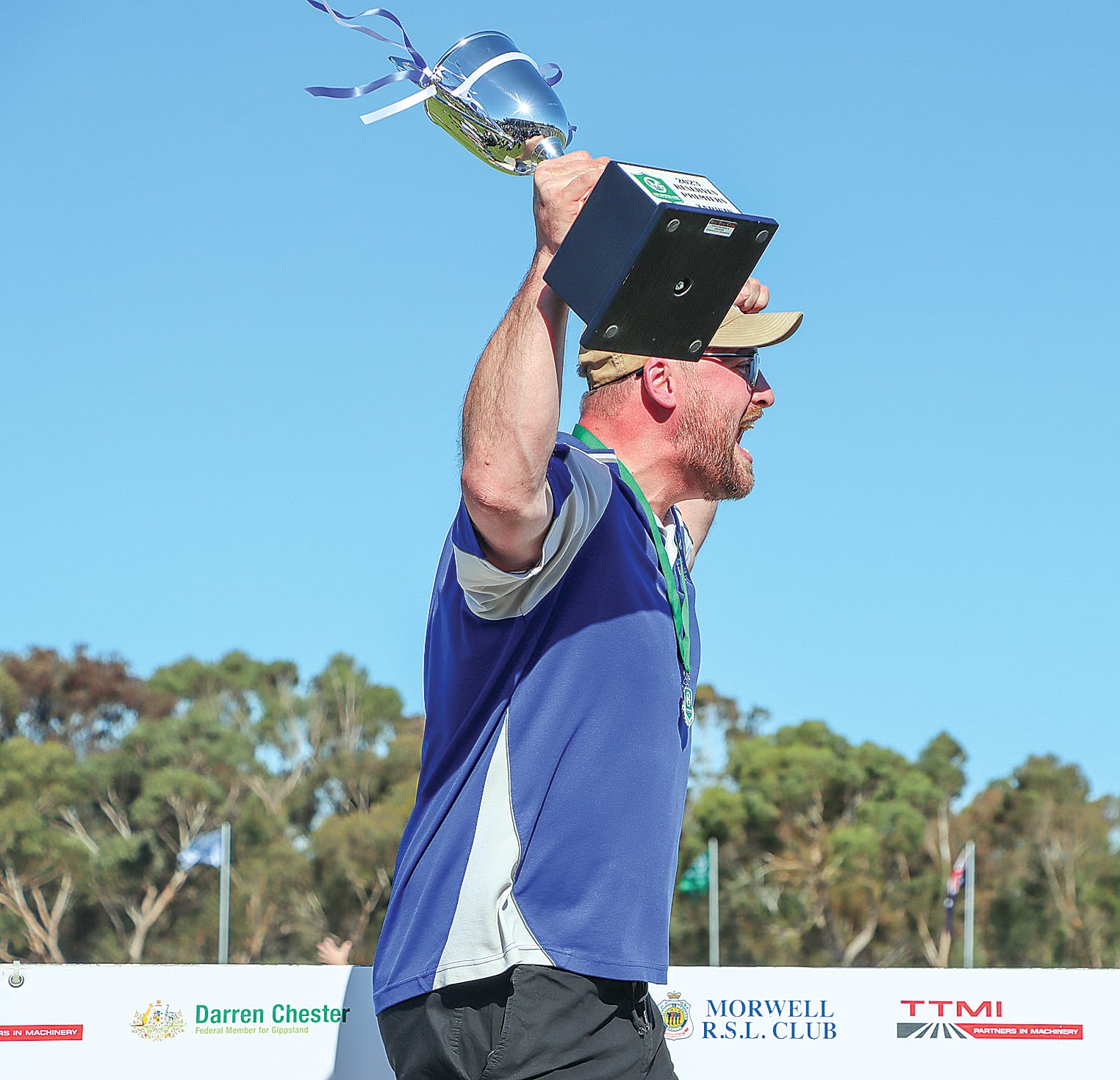 Celebrating his team’s victory Tarwin coach Jake Cochrane raises the 2023 Reserves premiership cup. A32_3823