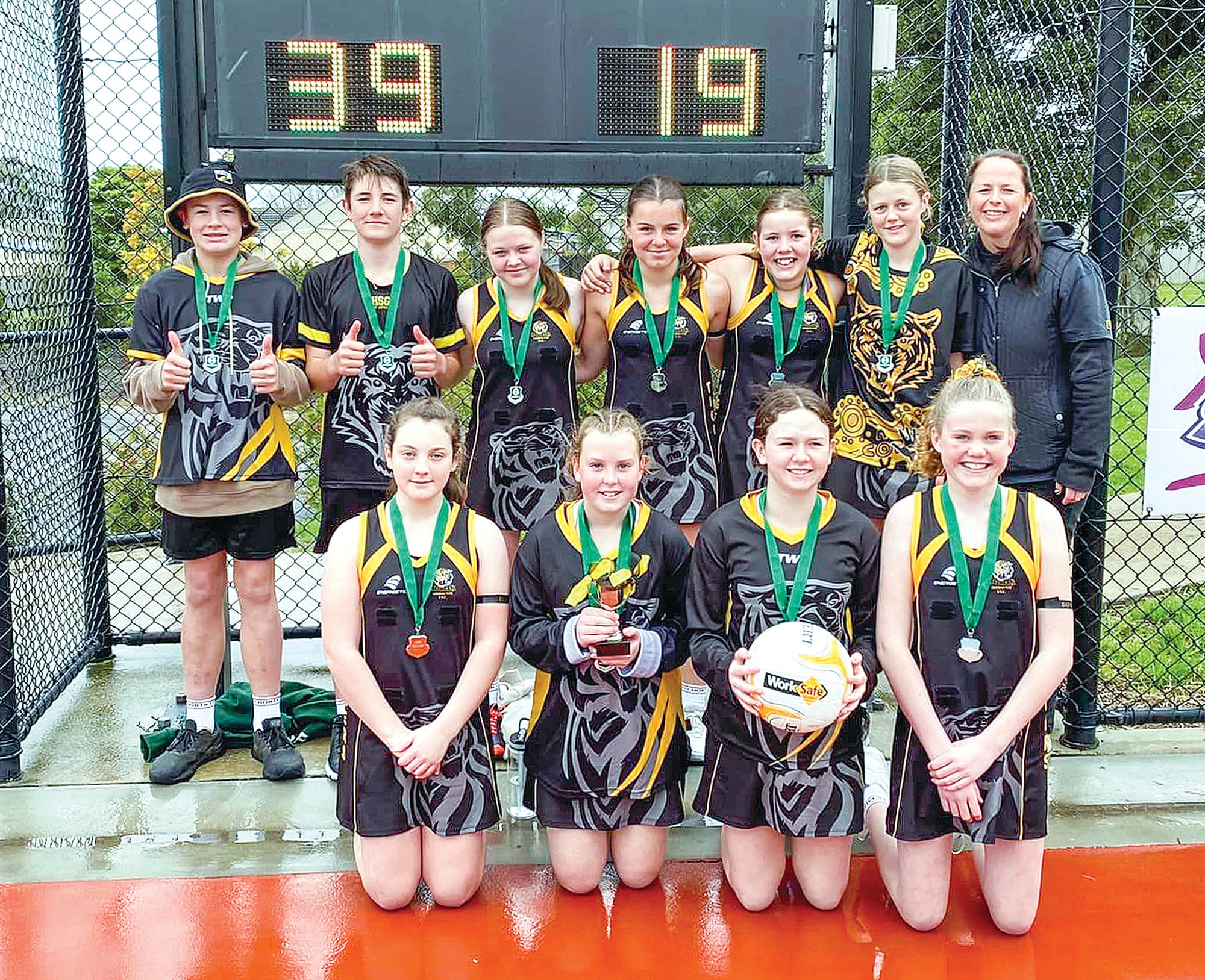 Mirboo North’s Under 13s were proud to take the premiership cup after facing off against Hill End. Photo: Mid Gippsland Netball