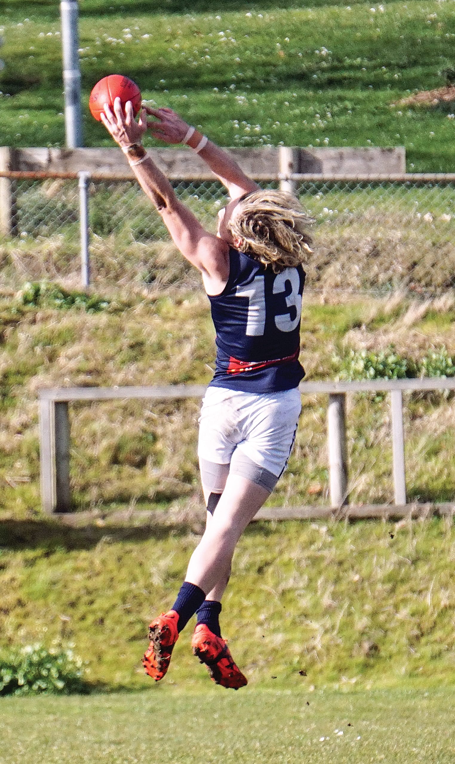 Jake Weightman secures a spectacular mark just on the fingertips. 
