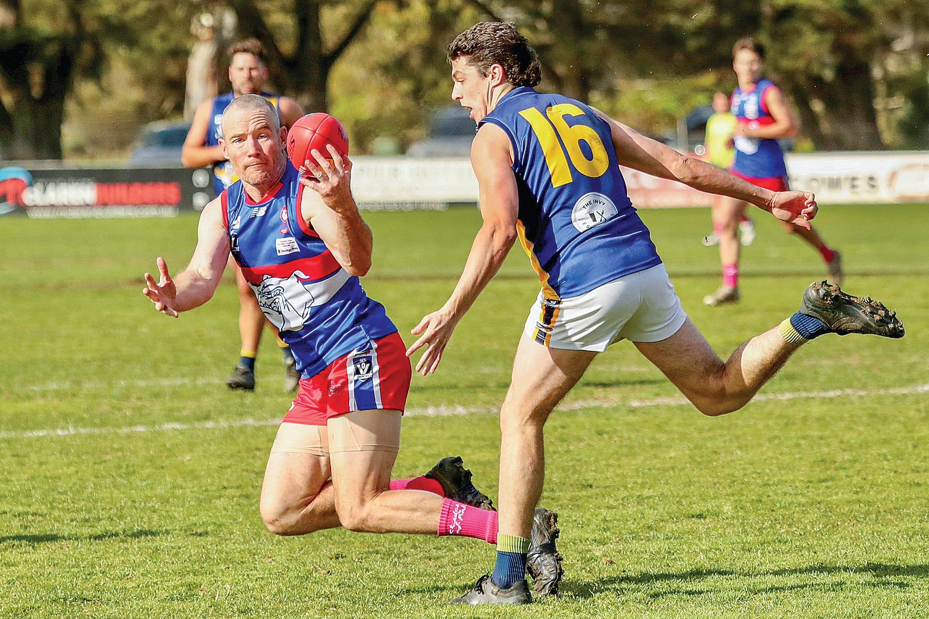 Brendan Kimber flies in for the ball against Jack Butcher. Photos: Carol Ratcliff. 