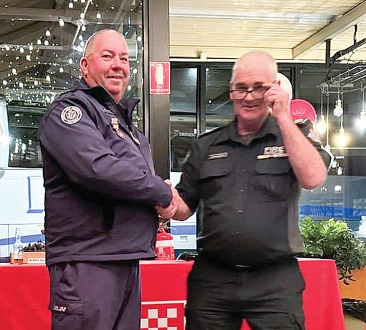 CFA Catchment Commander Gavin Parker presenting forty-year service award to Michael Austin.