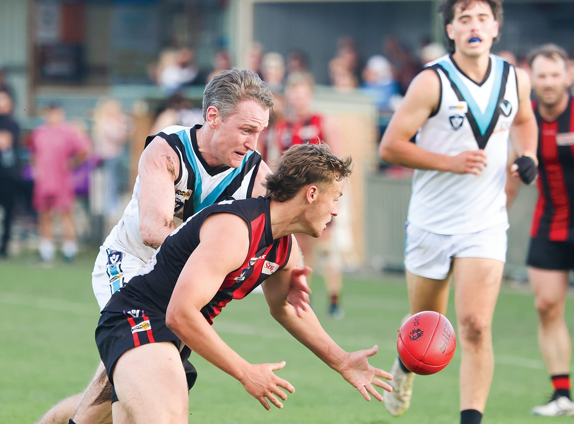Wonthaggi’s captain Aiden Lindsay keeps the pressure on Maffra’s Jack Challands in a near-perfect defensive game by the Power.