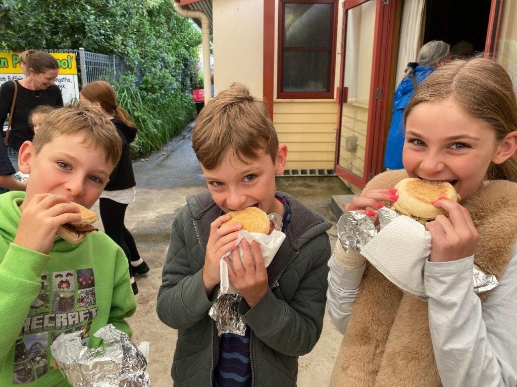 Yum. Zack, Flynn and Sienna Parnell get their teeth into their Australia Day celebrations at Meeniyan on Thursday.