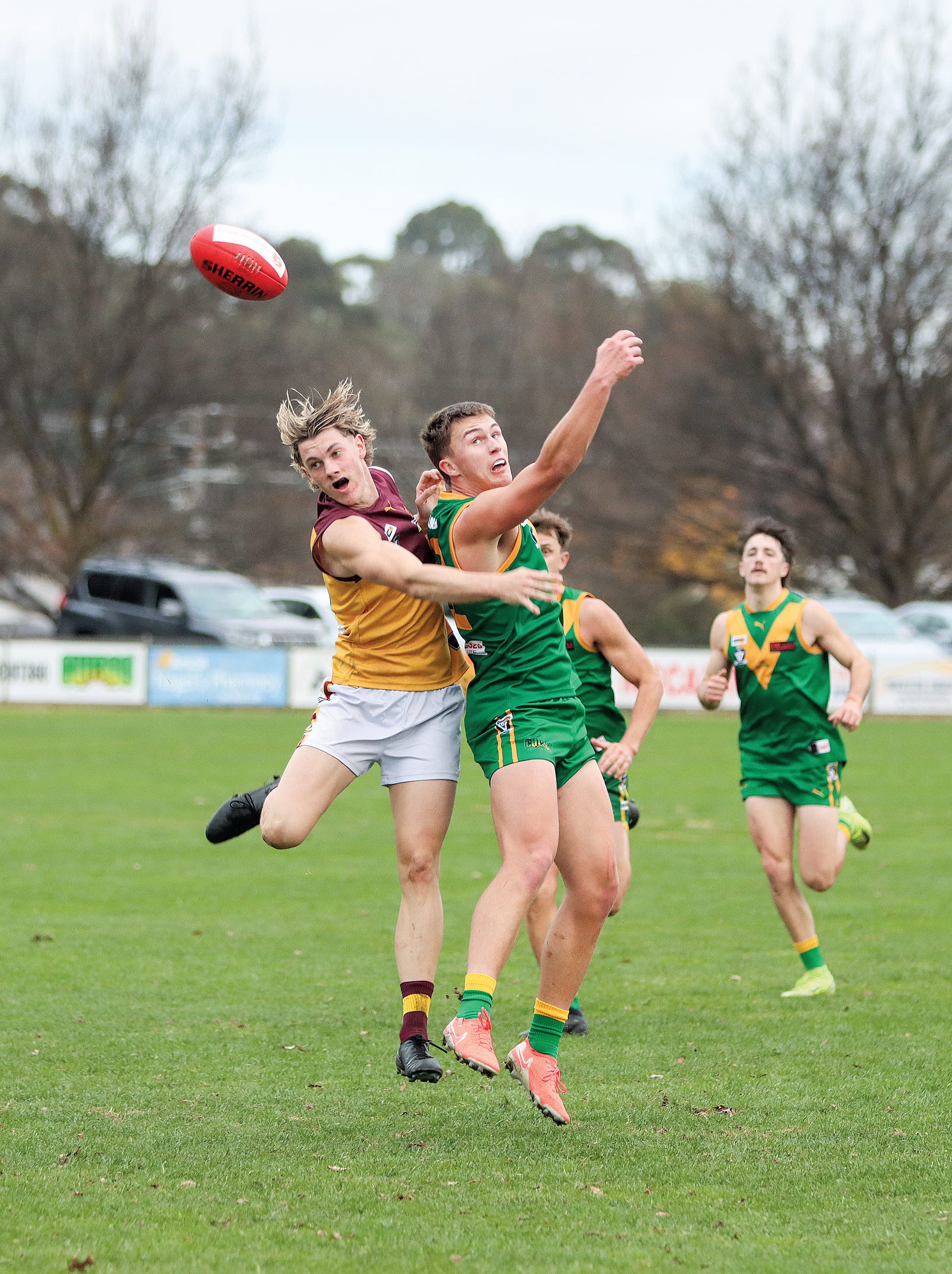 Drouin tries to keep Patrick Ireland under wraps during this contest but he finished the day with three goals. A19_2225
