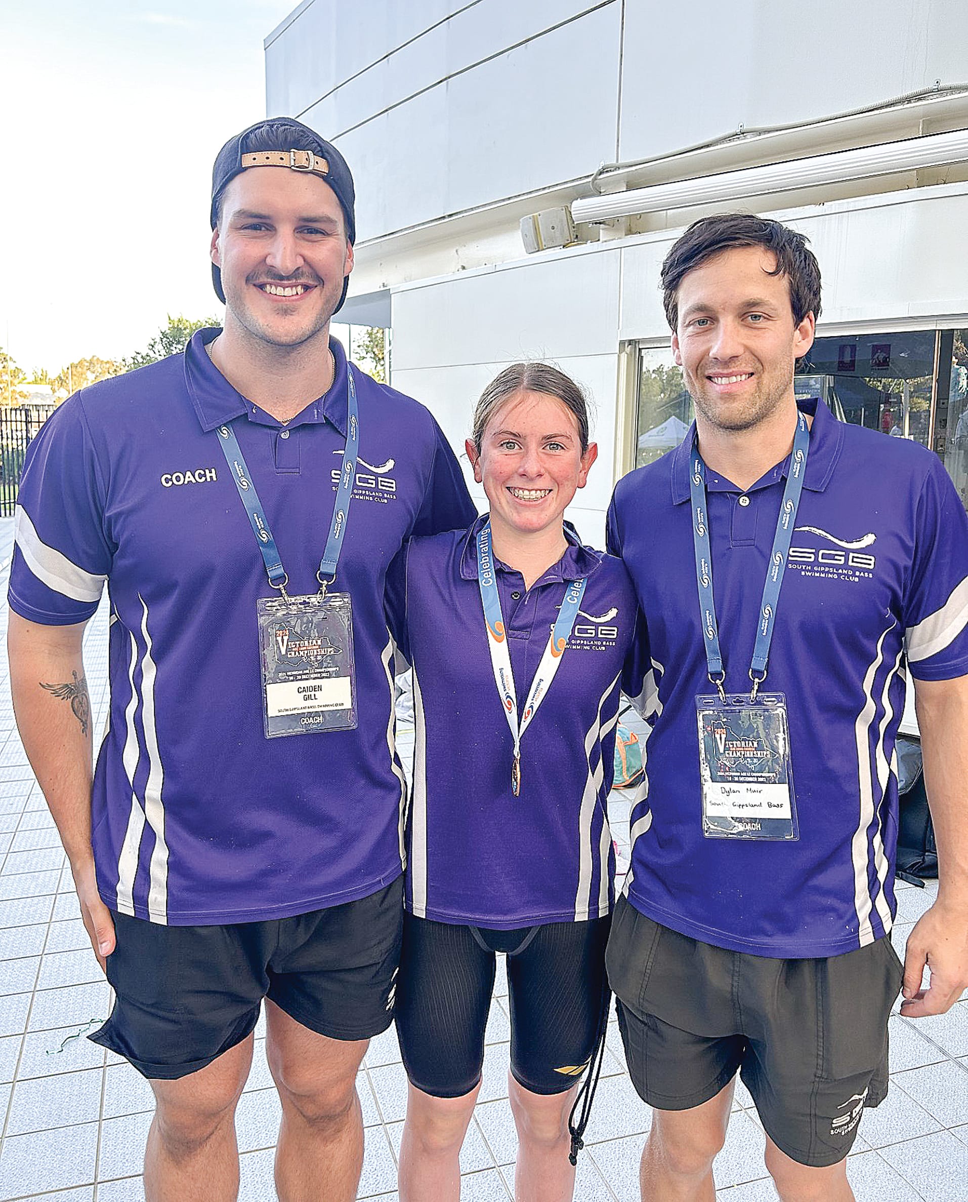 Claudia and coaches Caiden and Dylan - who said there’s been some up and downs on swimmers’ times but mostly it’s been an improvement.