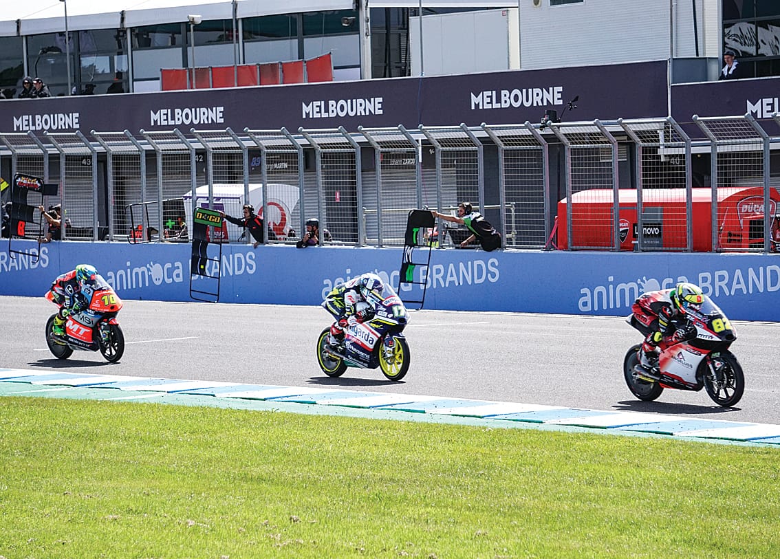 Riders battle it out along the straight in the Moto3 race.