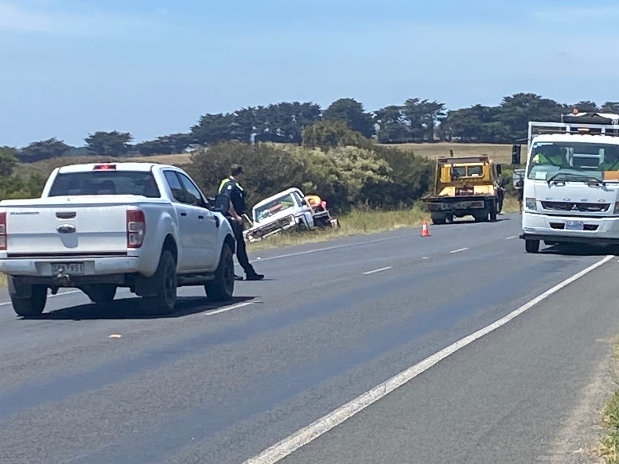 This is the white utility vehicle, towing a trailer with a four-wheel motorbike on board which is believed to have been involved in a collision with a stationary police car on Phillip Island Road at Surf Beach.