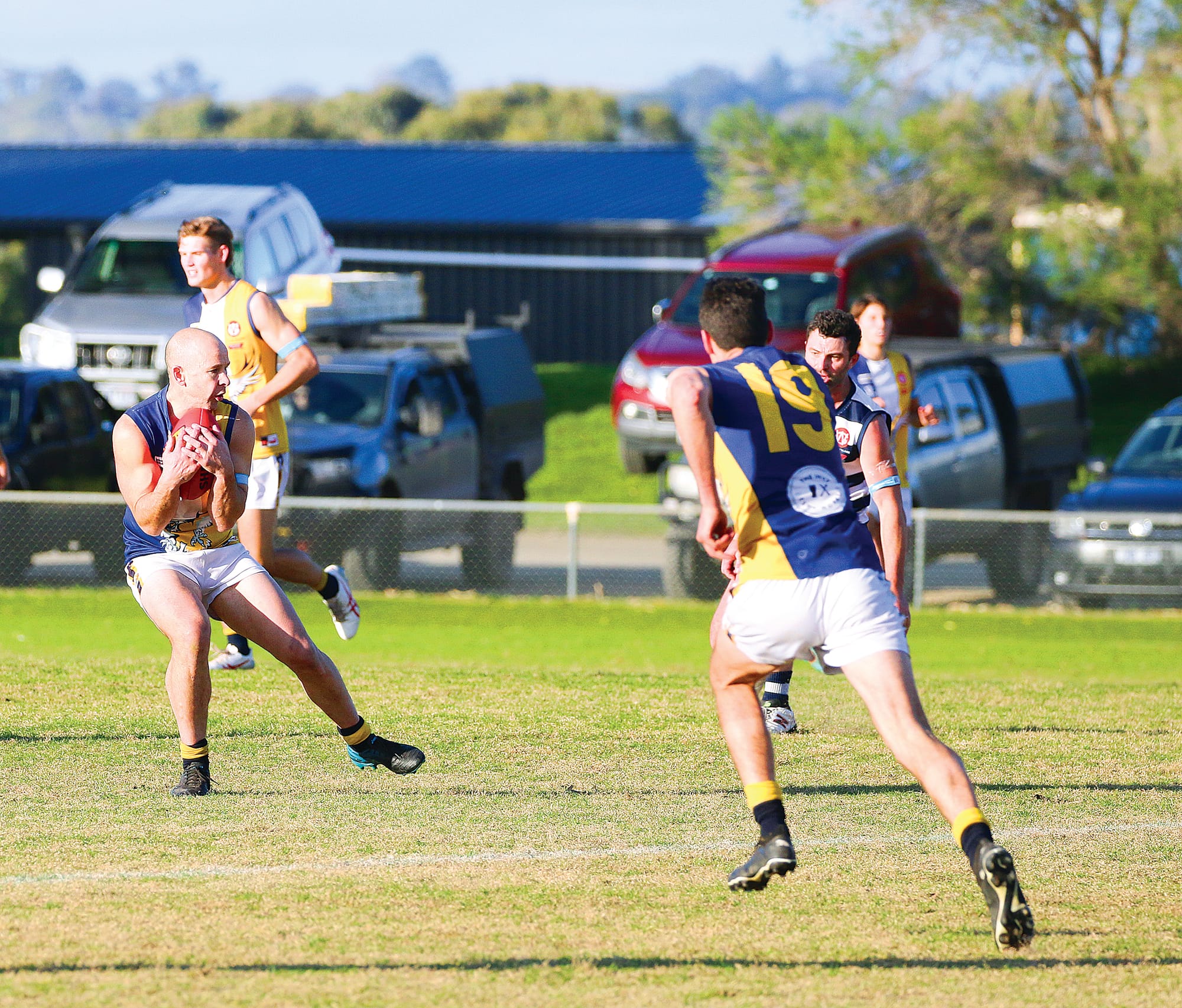 Andrew Soumalis wraps up a chest mark. ob28_3023