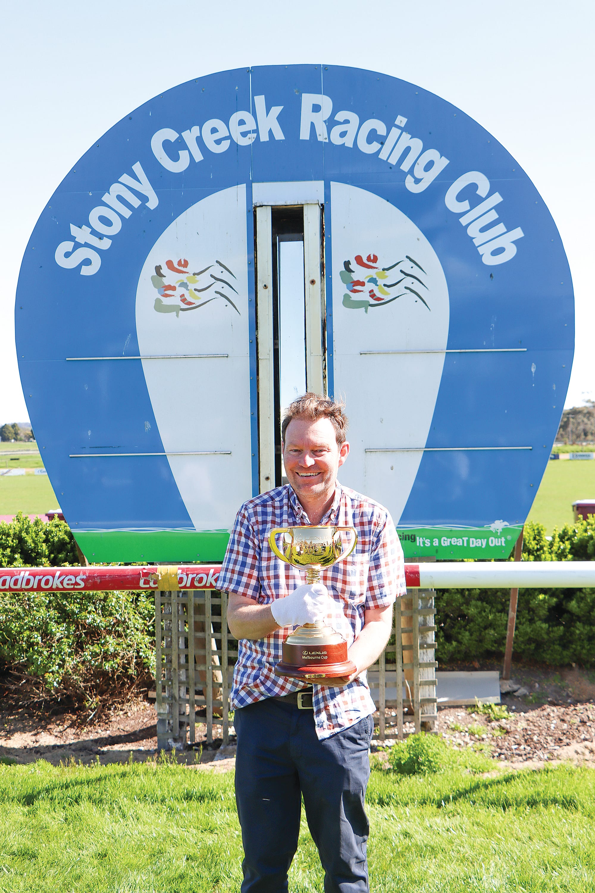 Sentinel-Times journalist Andrew Paloczi seizes his chance to hold the Melbourne Cup.