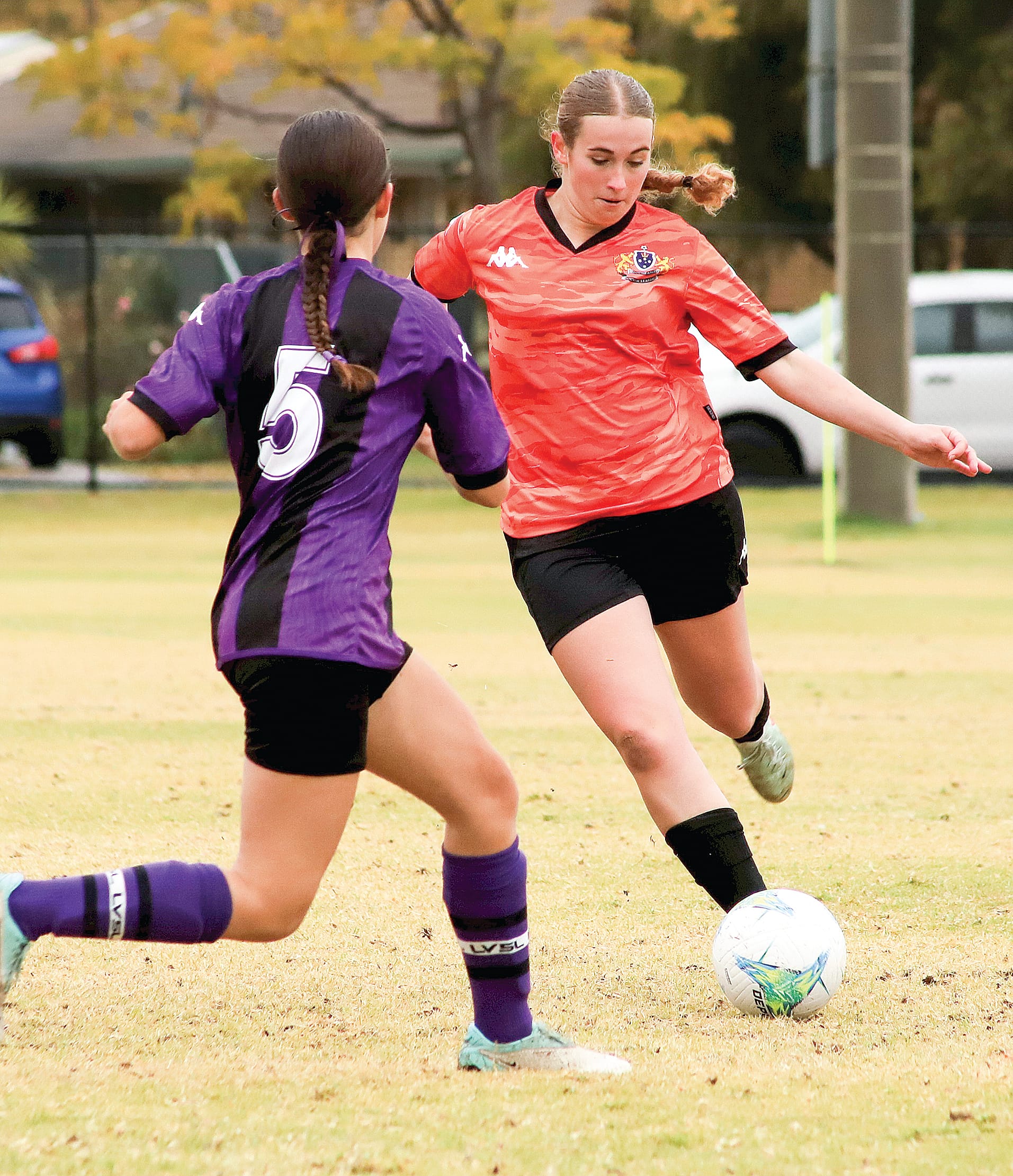 U16 Girls centre back Michaela Marr clears the ball from defence against her Latrobe opponent.