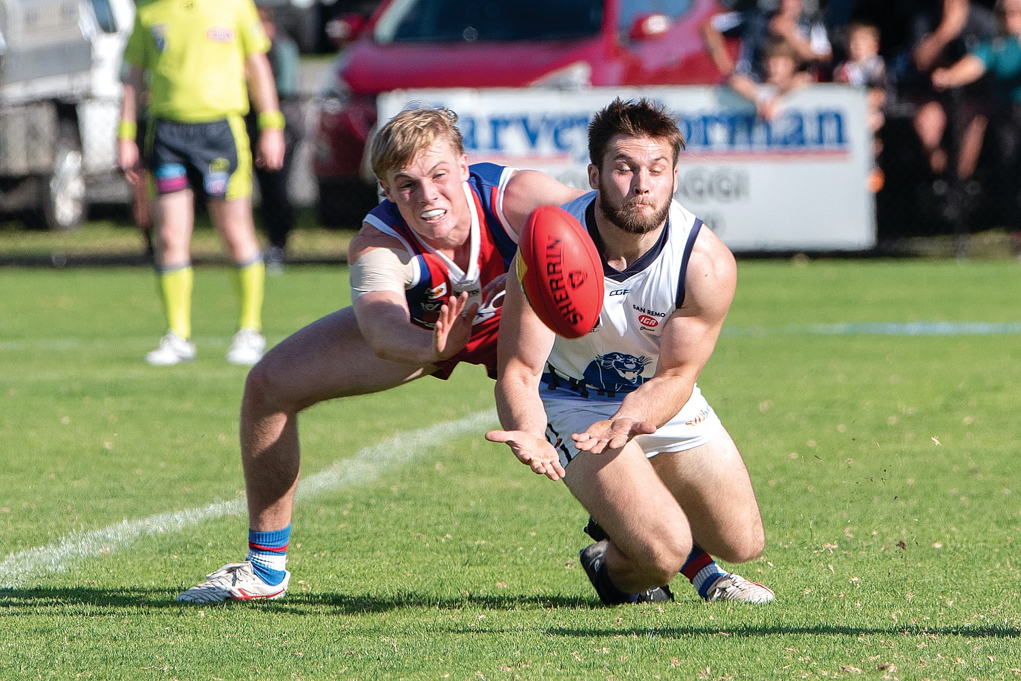 Bradley Aldwell (Kilcunda-Bass) attempts to mark under pressure from the Island’s Charlie Bruce. Photo: Anna Carson