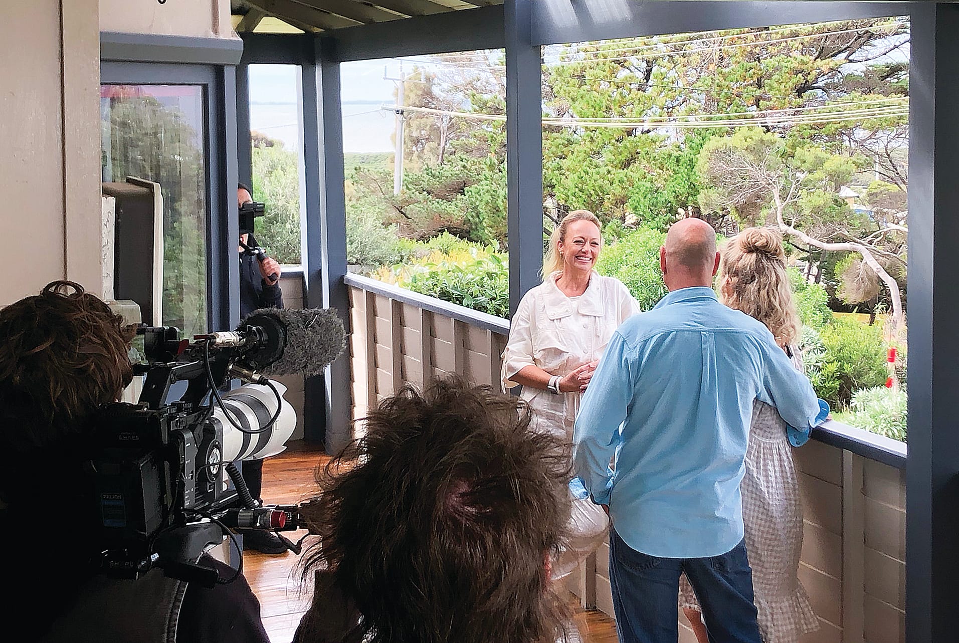 Enjoying the view of the bay from The Homestead at Surf Beach on Dunvegan Crescent, host Shelley Craft shoots the first season of Beach House Hunters Australia.