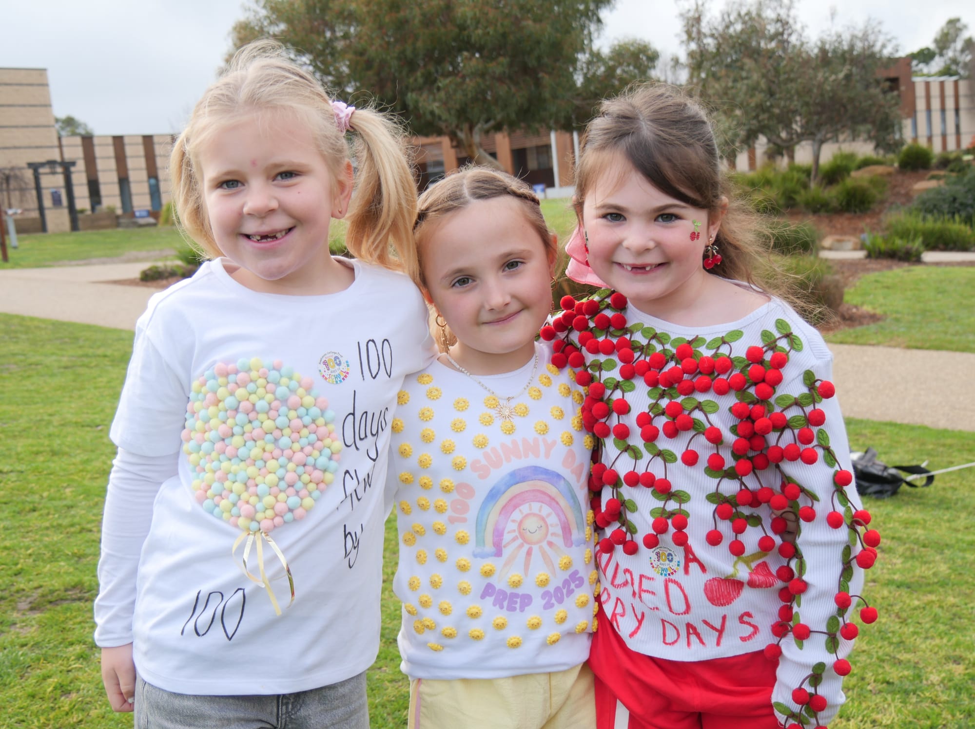 Best buds Winter Shepherd, Sunny Jose and Indi Muratore wore 100 pom poms, 100 suns and 100 cherries between them. Celebrating their 100th day at school is a big achievement.