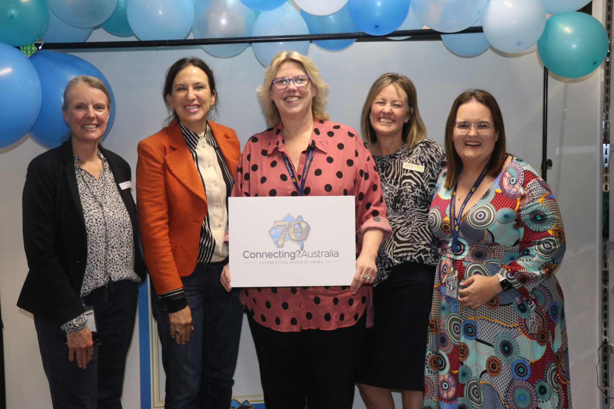 Kristen Yates-Matthews of Bass Coast Health, Bass MP Jordan Crugnale, C2A Business Manager Jenn Hockey, Deputy Mayor Cr Rochelle Halstead, and Senior Support Worker Claire Walmsley together celebrated 70 years of disability support through C2A. 