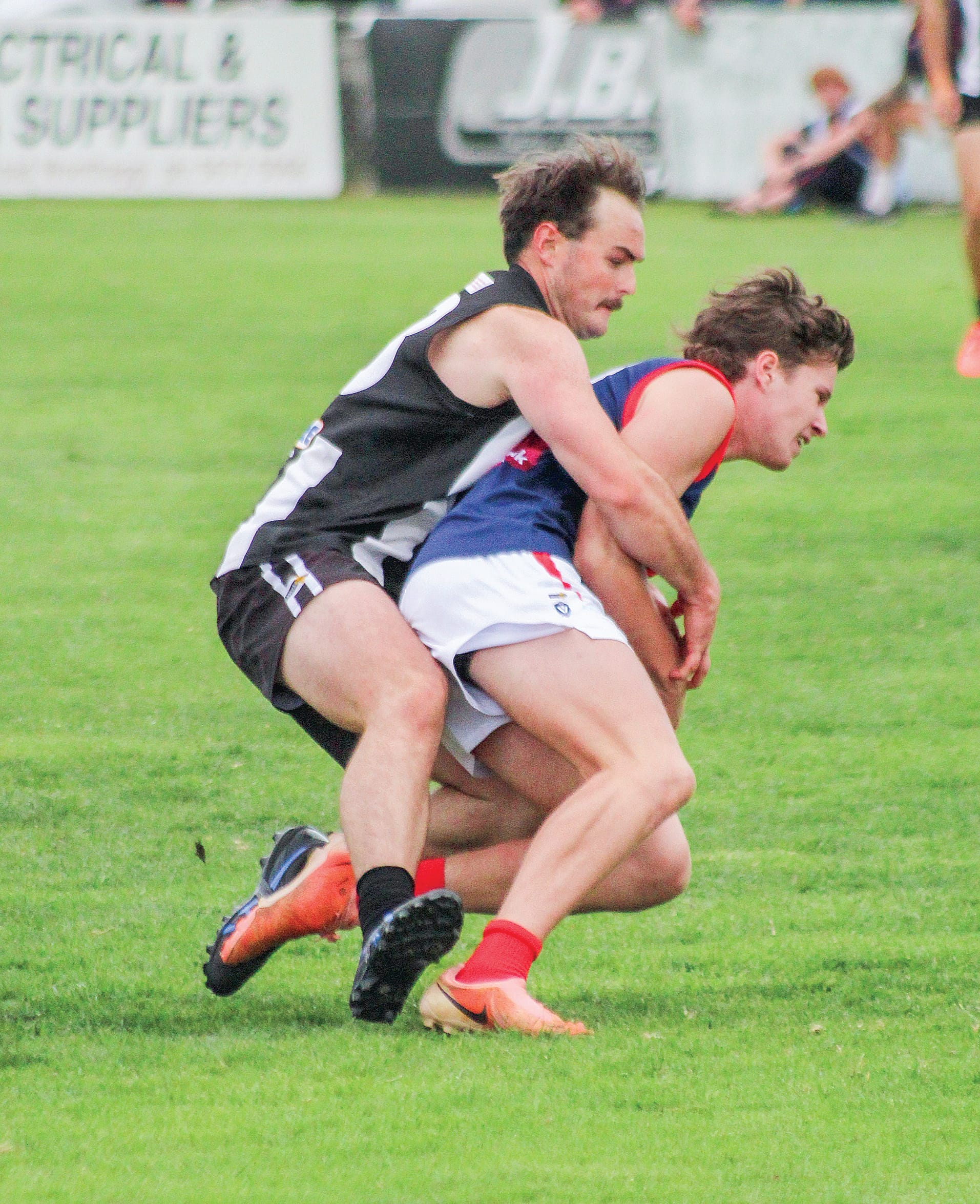 Hayden Wallace lays a tackle for Dalyston during its close match against Koo Wee Rup. Photo: Angus Chisholm.
