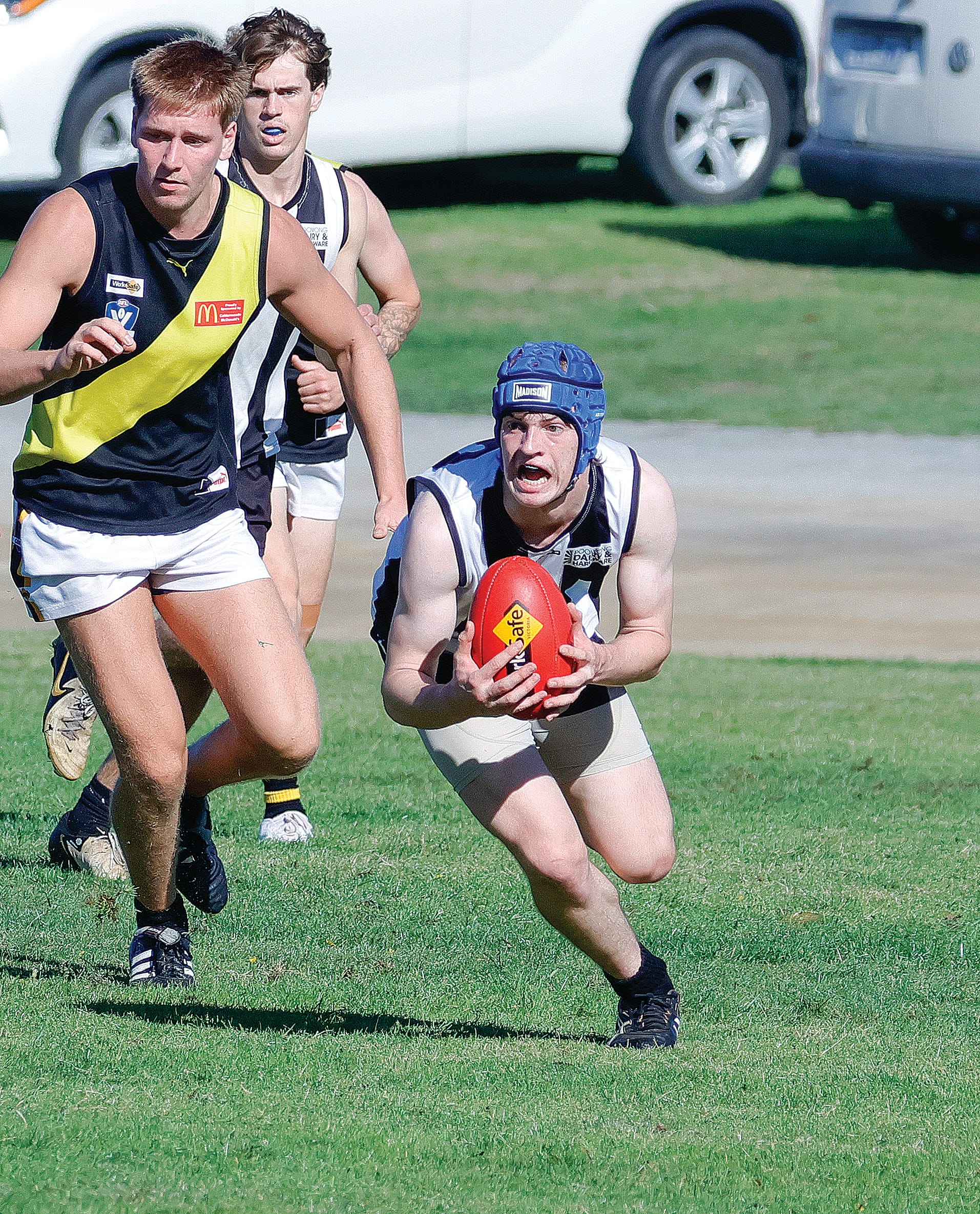 Marty Cook charges clear for Poowong during its thrilling Under 18 win over Lang Lang. Photos: Jeff Tull.
