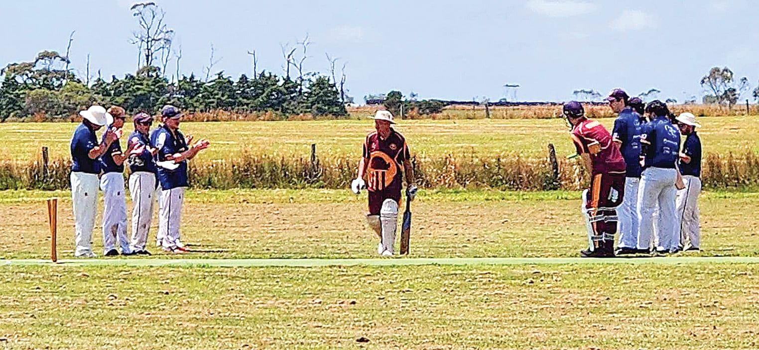 Wonthaggi Club players form a Guard of Honour for George Lomagno as he arrives at the crease in his 500th match for OMK.