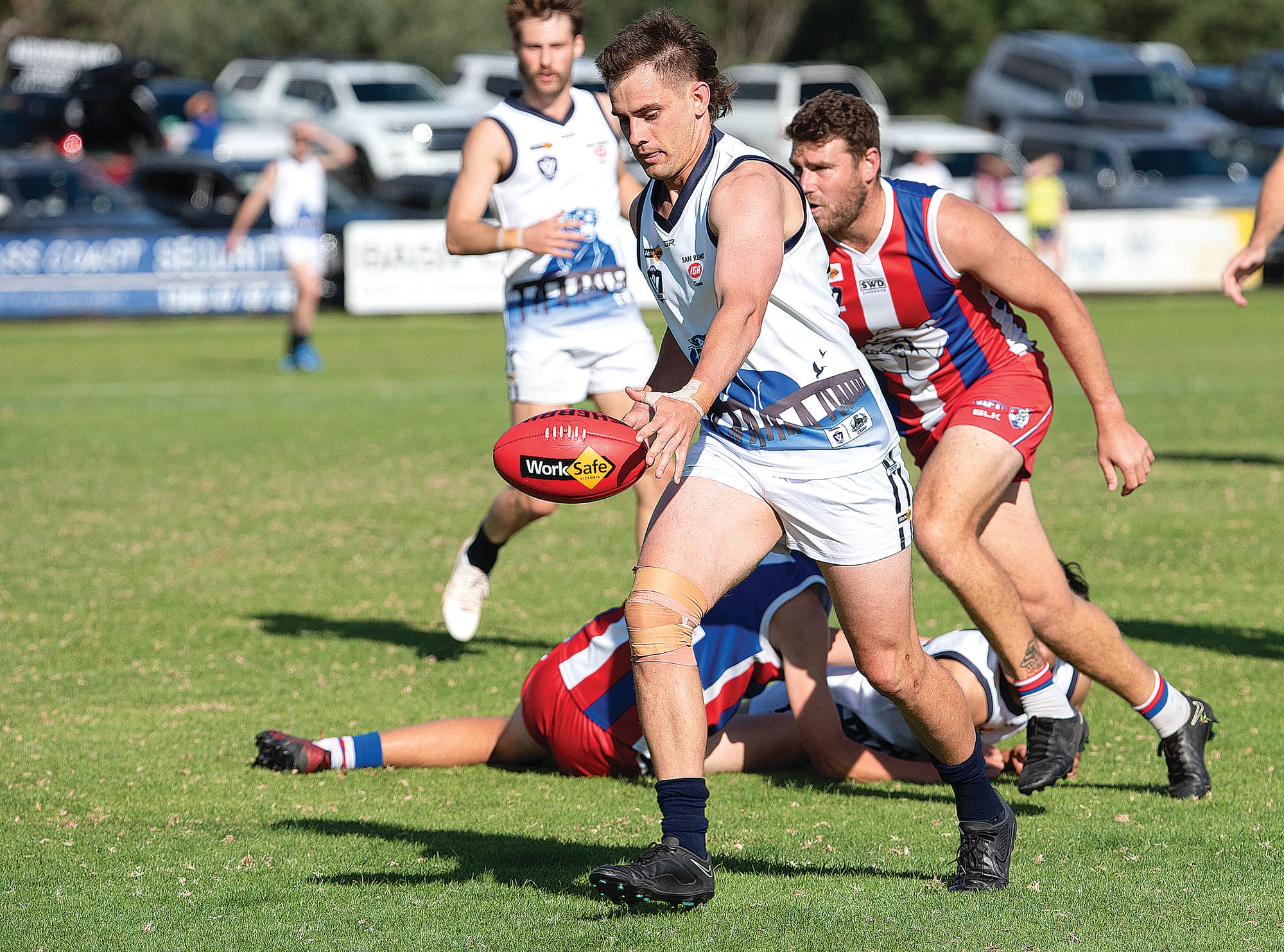Steven Scott clear from the pack to send the ball forward for Kilcunda-Bass.
