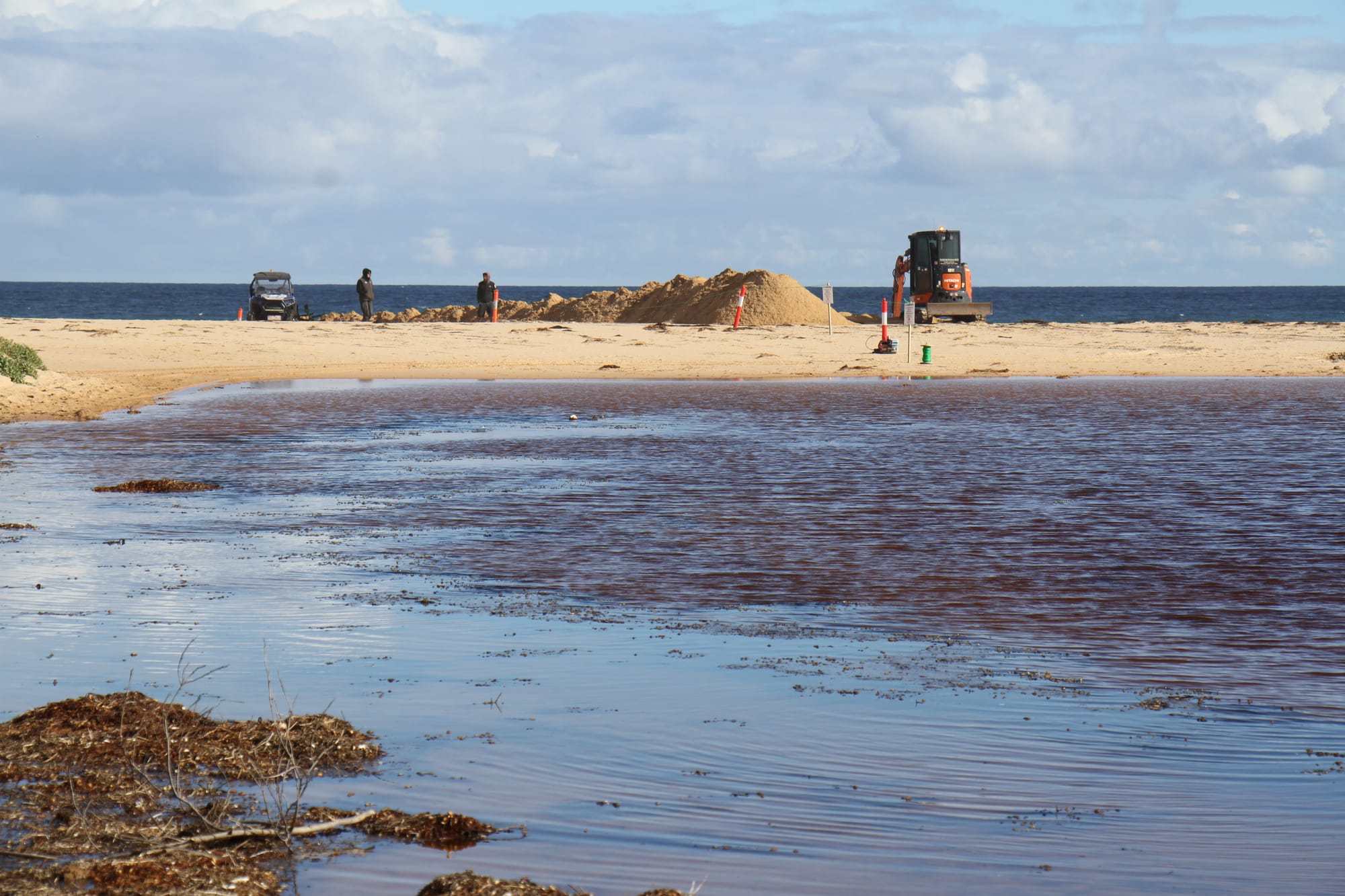Dredging works are underway to open the mouth of the Powlett River after inundation of farmland upstream. B33_3125