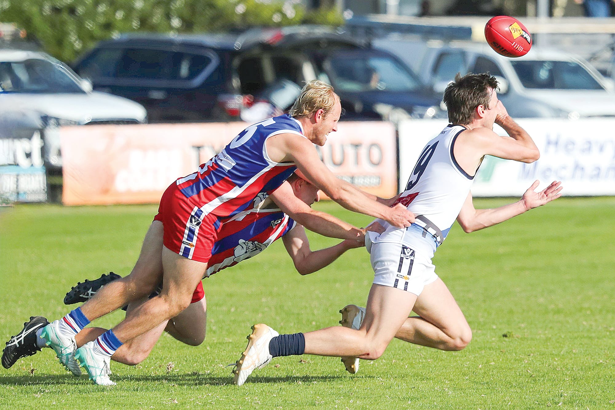 xCFootballPI02_1824
Marcus Wright and Connor Thompson tackle Kilcunda-Bass’s Joseph West during Saturday’s Battle of the Bridge clash. Photo: Carol Ratcliffe.