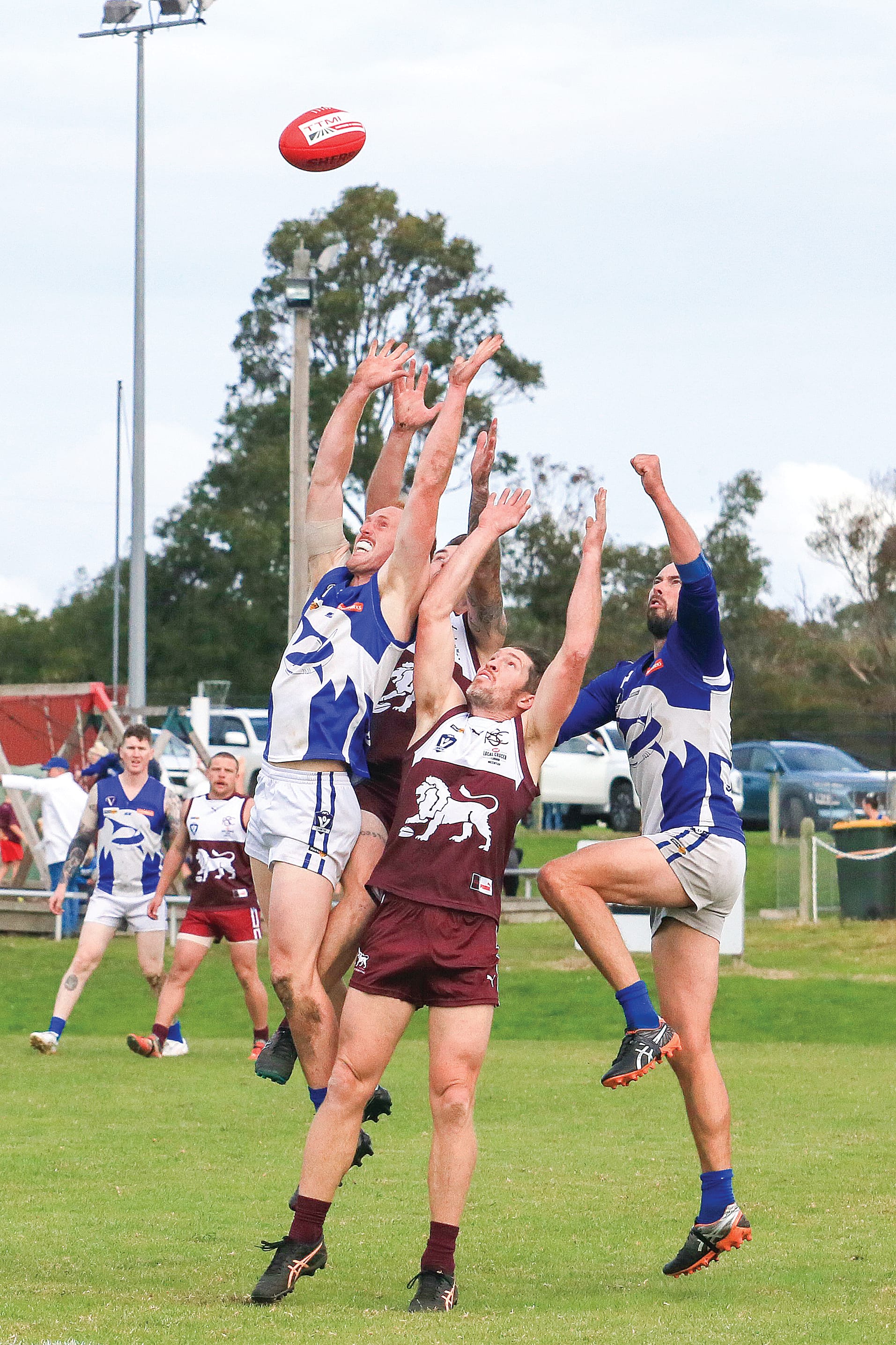 Ben Chalmers, Cam Stone and Stu Kilsby go airborne to grab the Sherrin on Saturday. Photos: Gerard Bruning.