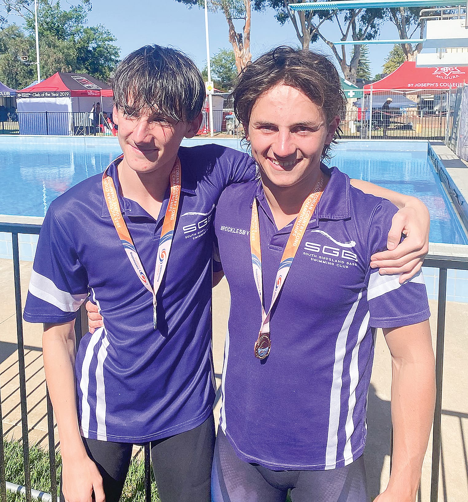 Cormac and Billy celebrate their breaststroke success.