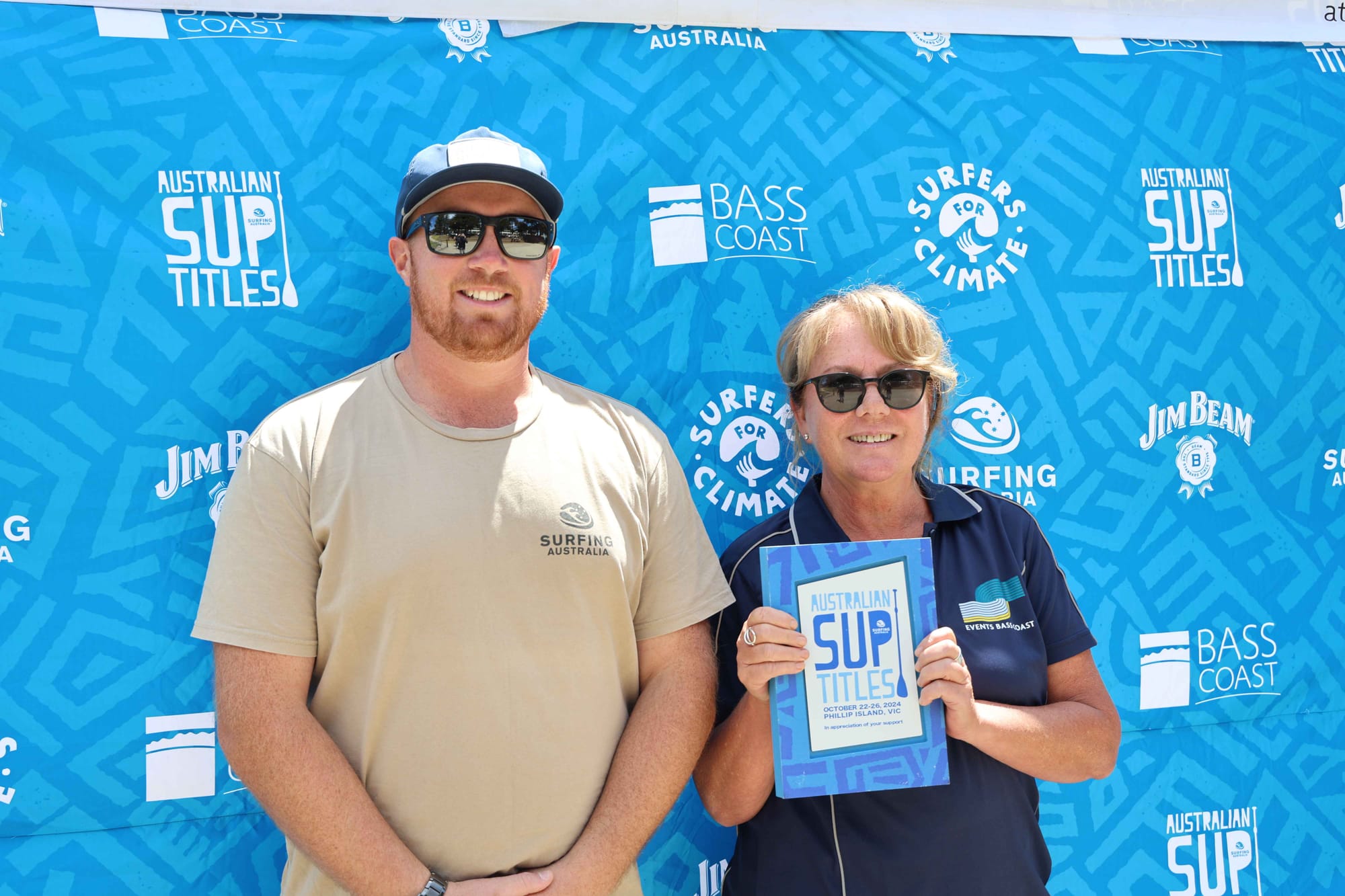 Bass Coast Shire Council representative Jenny Macmillan receives an appreciation award from Surfing Australia's Rohan Fell in recognition of the local shire's support for the Australian SUP titles last week.