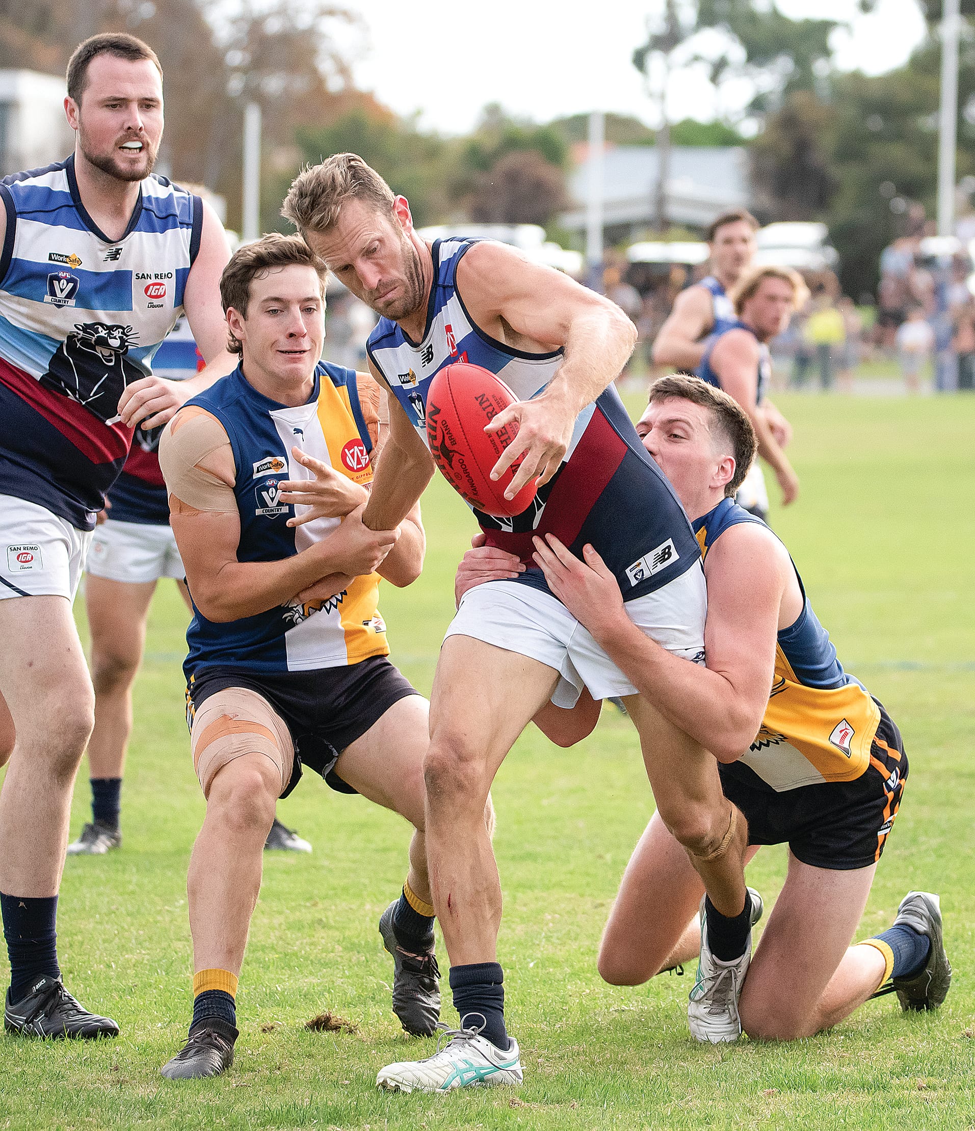 Travis Tuck remains calm finding boot to ball under pressure from his IK opponents. Photos: Anna Carson