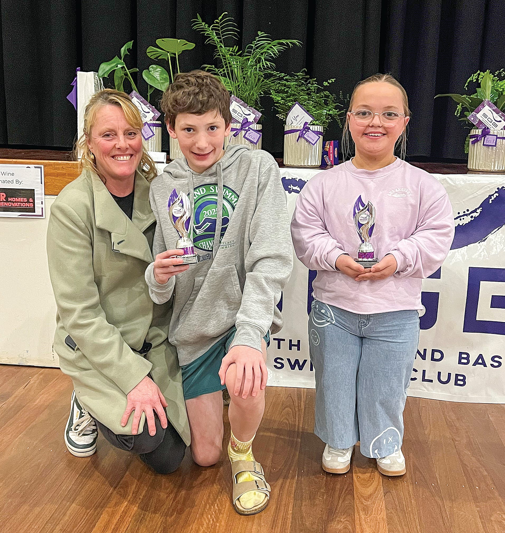 Multiclass male and female champions Coach Lorri with Levi Jarrett and Gemma Cook.