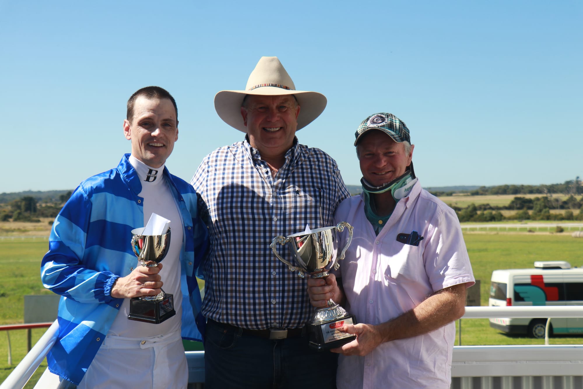 Jockey Ben Moffat with Greg Price of Alex Scott & Staff and owner of Woolamai Cup winning horse Popeye the Sailor, Ray Douglas. 