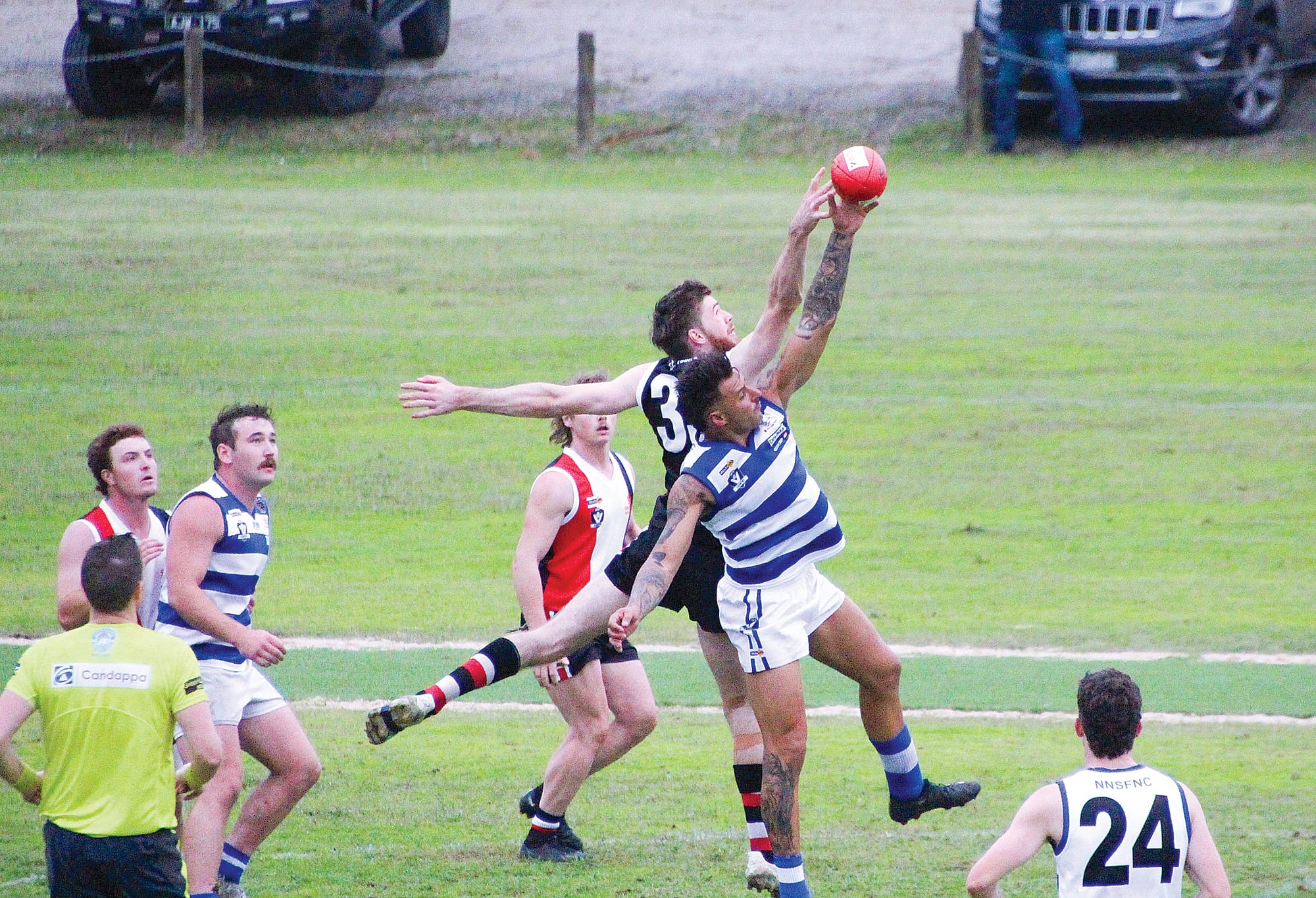 Travis Stewart just misses the ball as he contends the ruck.
