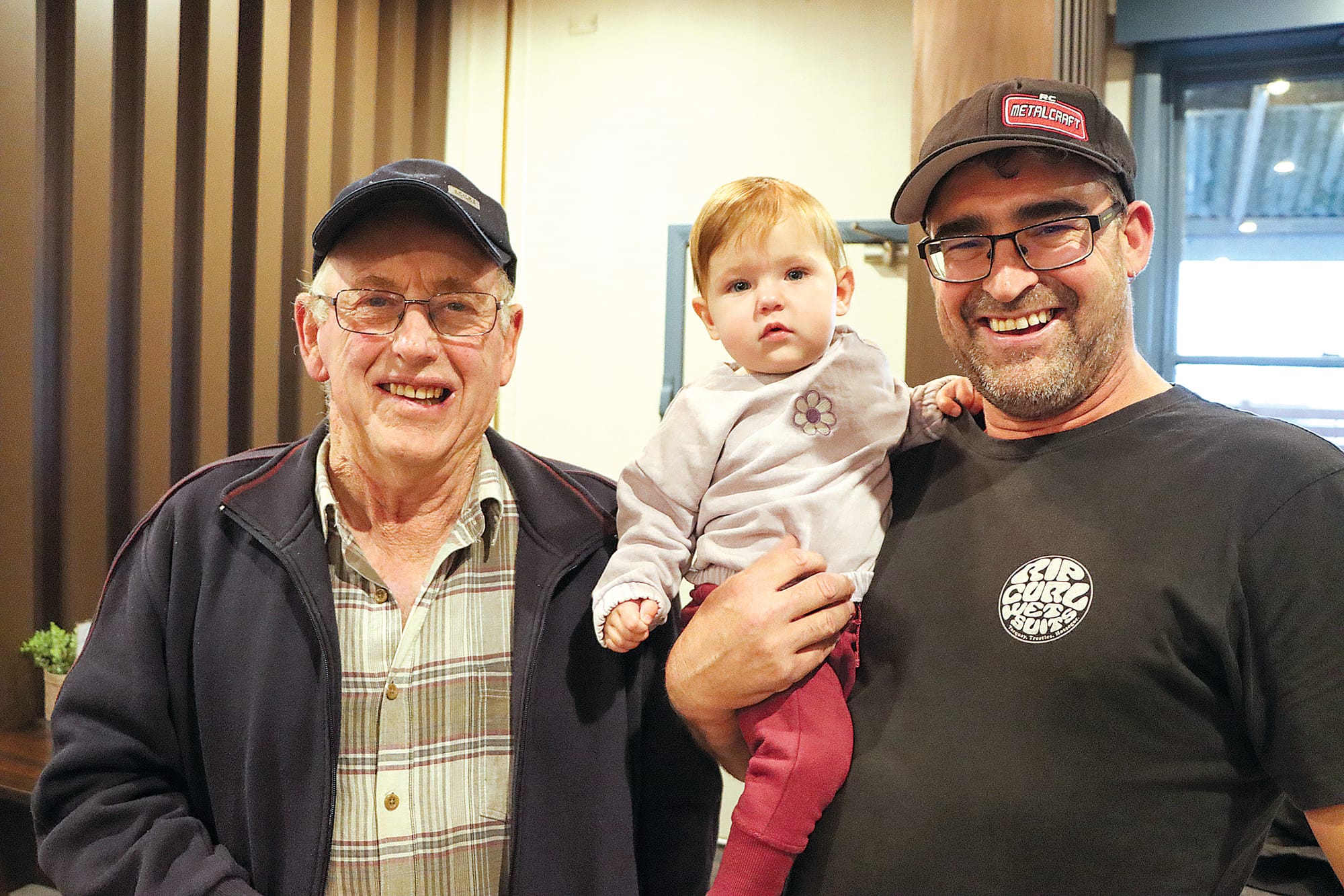 Charlie Thomson and Kiara and Bobby Dorling enjoy the celebration of Eddie and Helen Fowler’s business longevity. A33_2124