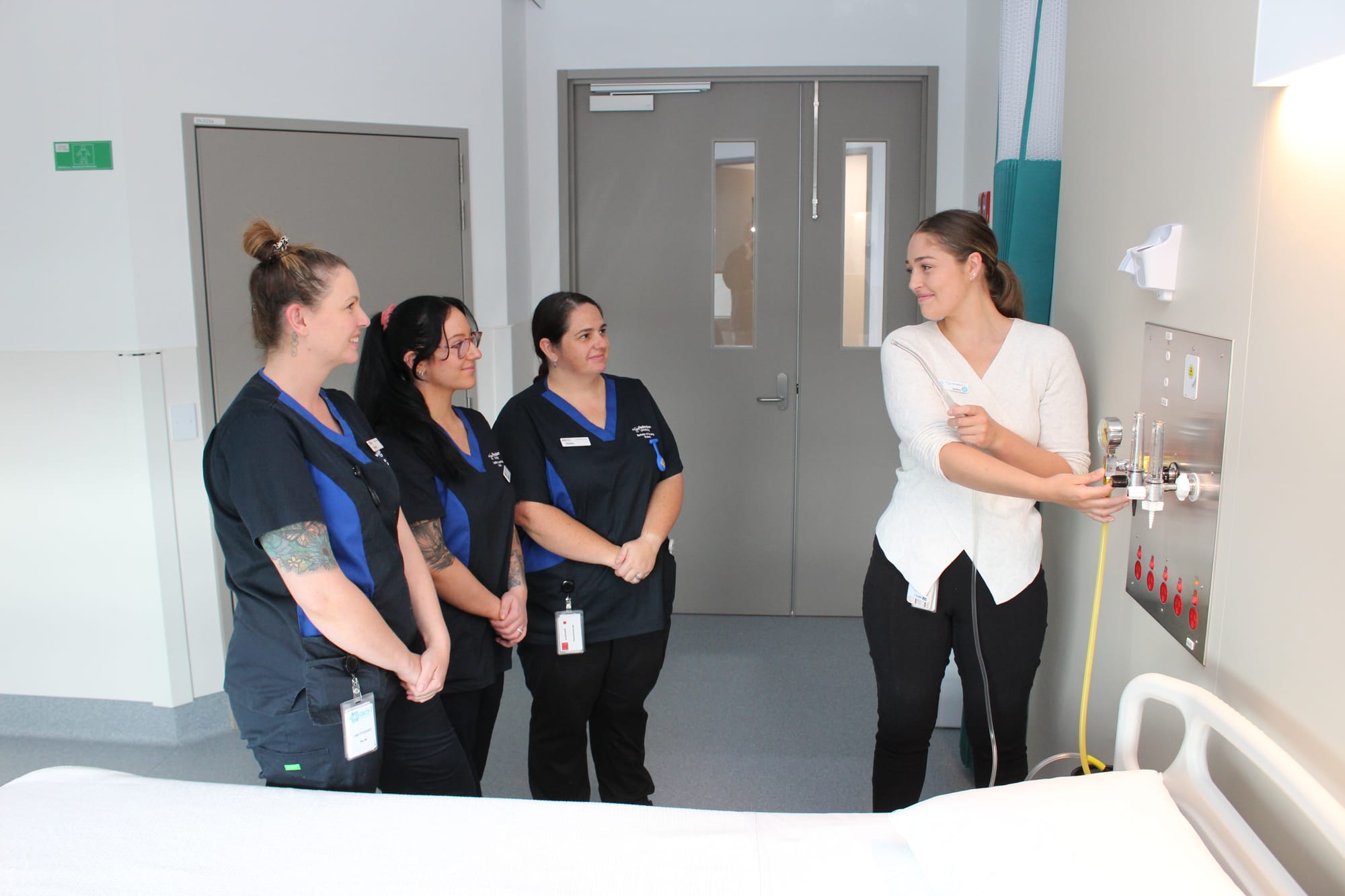 Nursing Students Karley Bentley, Kiera King and Emma Evans receive instruction from Undergraduate Coordinator Gabby O’Connor.