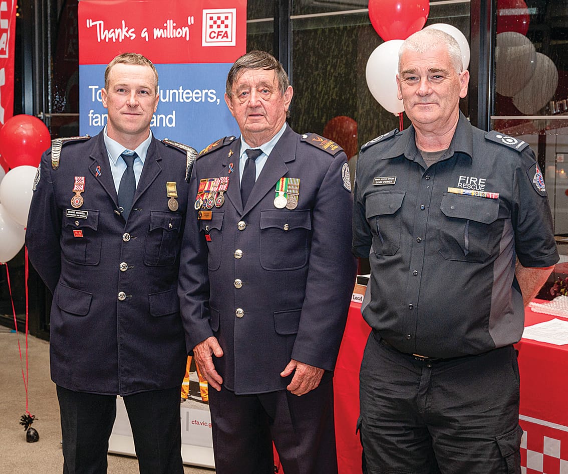 Brigade Captain Shane Maskell and fifty-year service award recipient Bill Rodda with CFA Catchment Commander Gavin Parker.